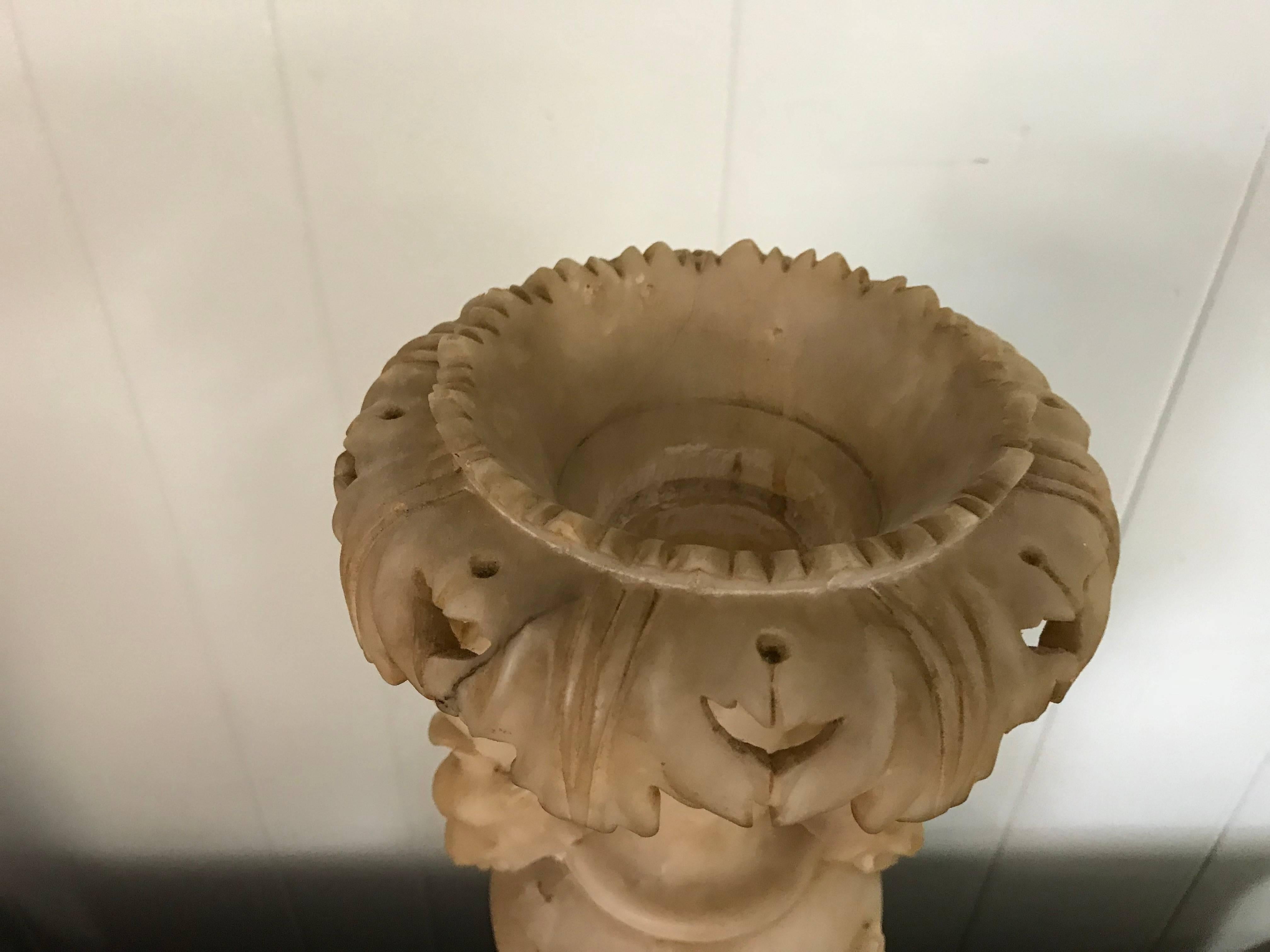 Offered is a fabulous, early 19th Century Italian alabaster urn with a hand-carved floral motif all-over and dragon motif handles. Good condition, minor professional repair work from previous owner. Center is hollowed can easily become a lamp.