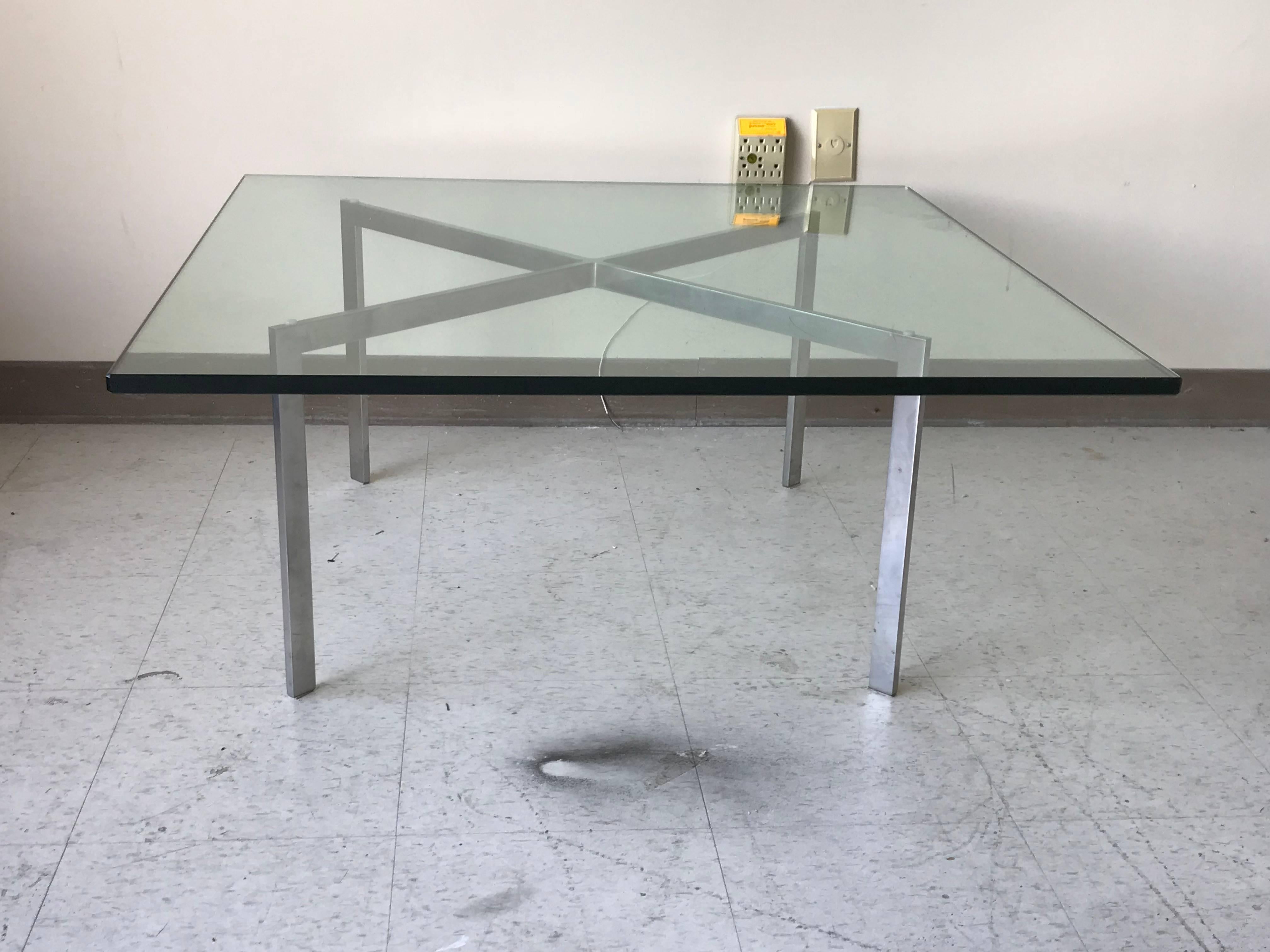 Offered is an exquisite, 1970s Mies Van der Rohe for Knoll, Inc. chrome Barcelona coffee/cocktail table with original glass top. Marked "KP" underneath, for Knoll Productions. Glass top is 40" x 40" and .75" thick. Can take