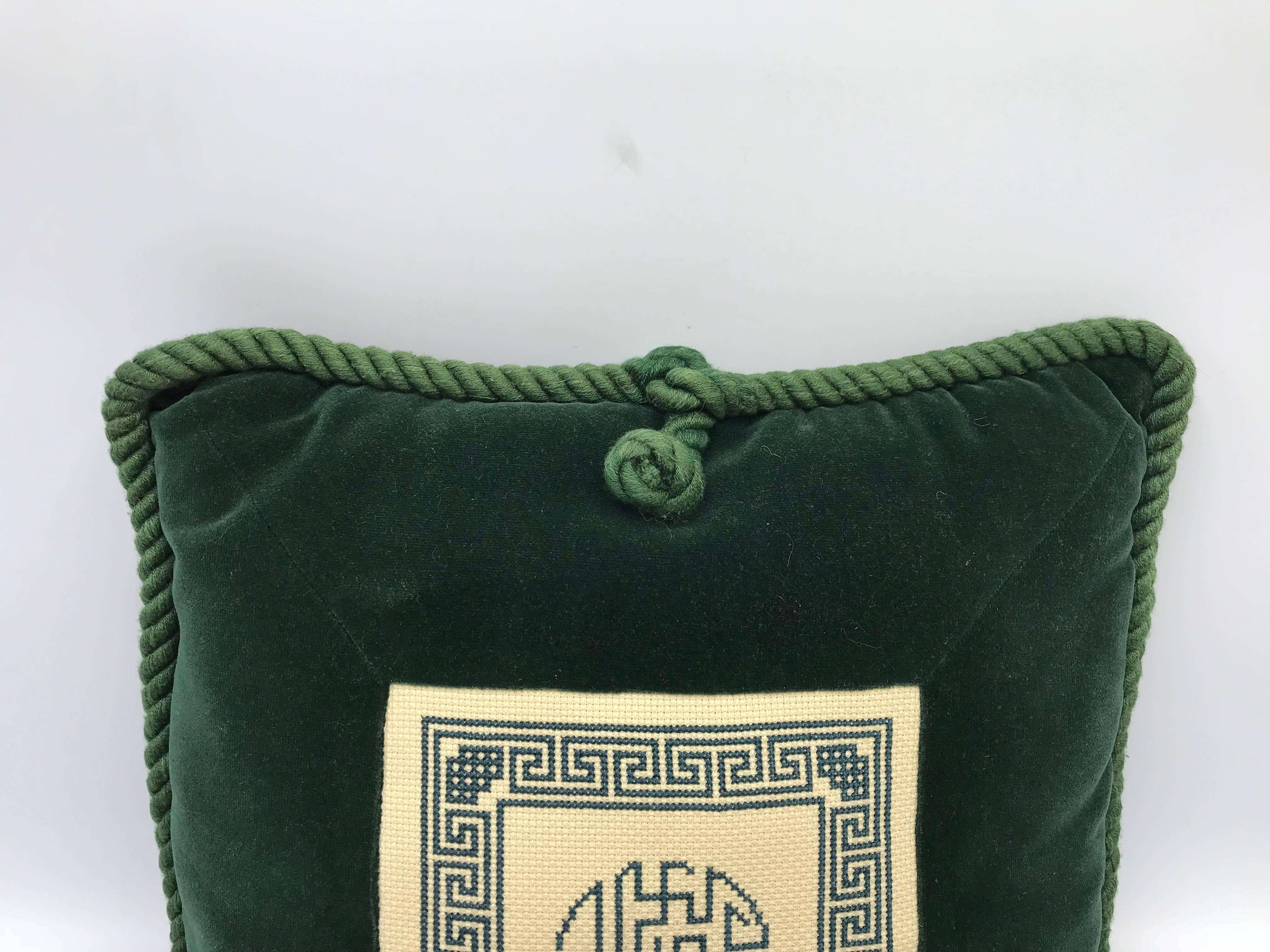 Offered is a fabulous, 1960s chinoiserie throw pillow with a white and green Asian needlepoint motif on green velvet. Matching dark green piping and tassel. Poly-blend fill.