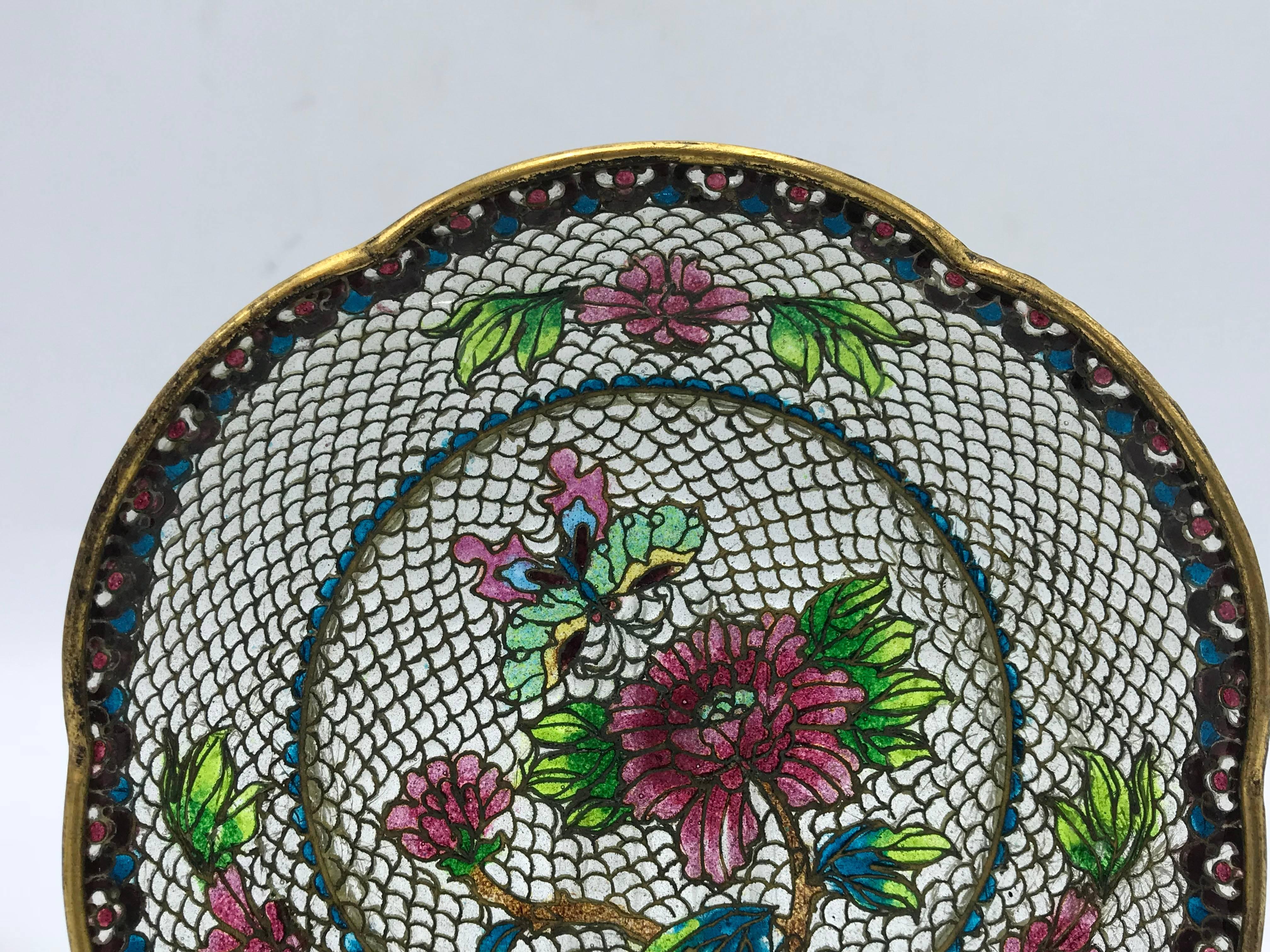 Offered is an exquisite, late 19th century French Art Nouveau, Plique a Jour cloisonné-enamel dish. The piece has a gorgeous butterfly and floral-inlaid motif all over.