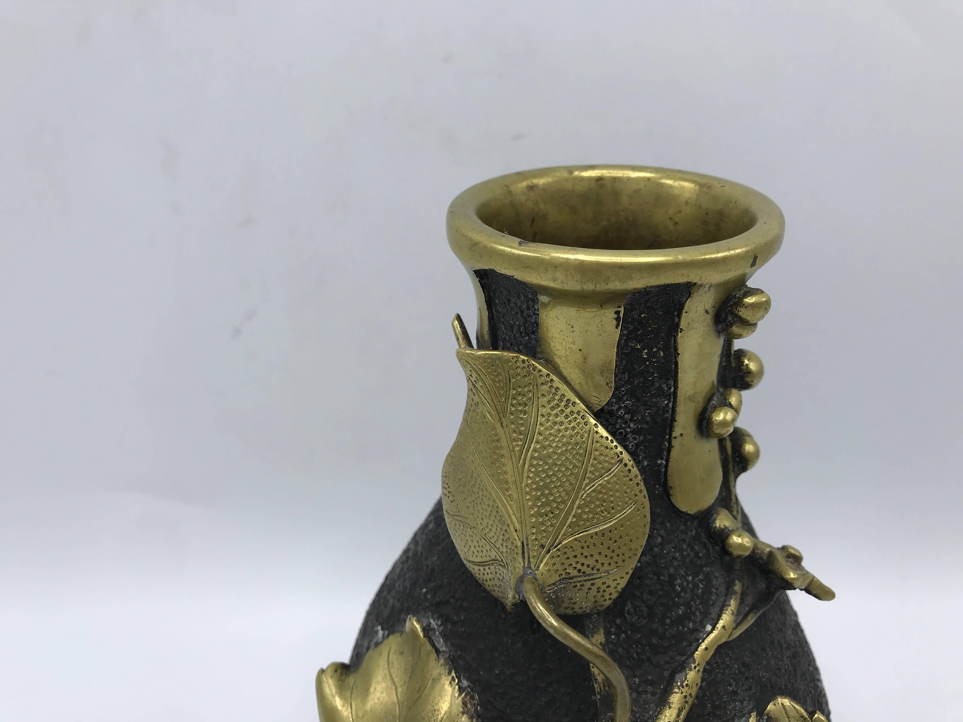 Offered is an immaculate, 19th century, French vase. The piece is solid bronze, with an organic trailing of sculptural gilded leaves and berries. Opening is 2.25" wide. Heavy.