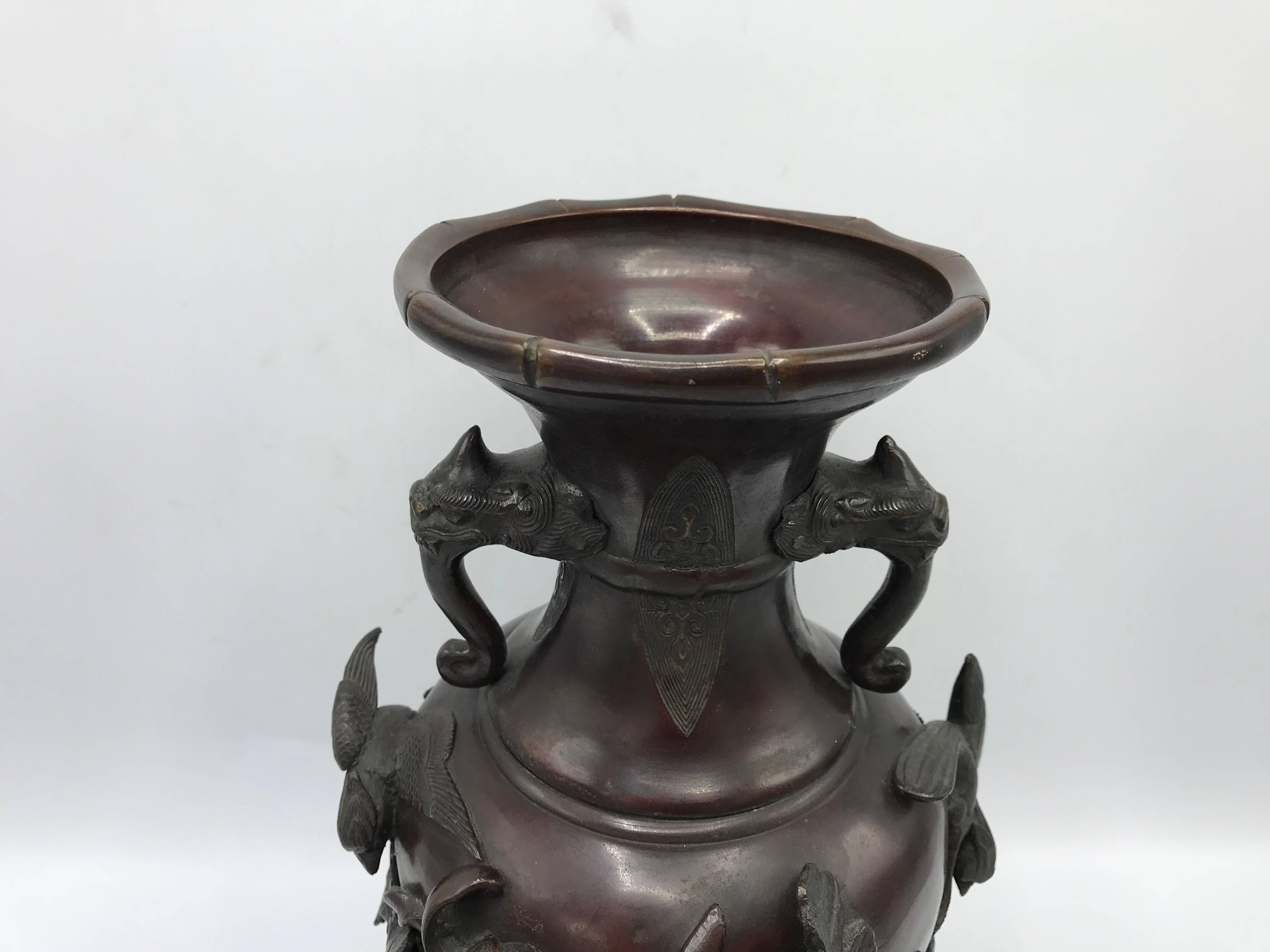 Offered is an exquisite, 19th Century, Meiji Period solid-bronze vase. The piece features immaculate, faux bamboo bordering along the top and bottom, sculptural elephants, turtles, and foliage. Mouth of vase is 4.75" wide. Stamped on underside.