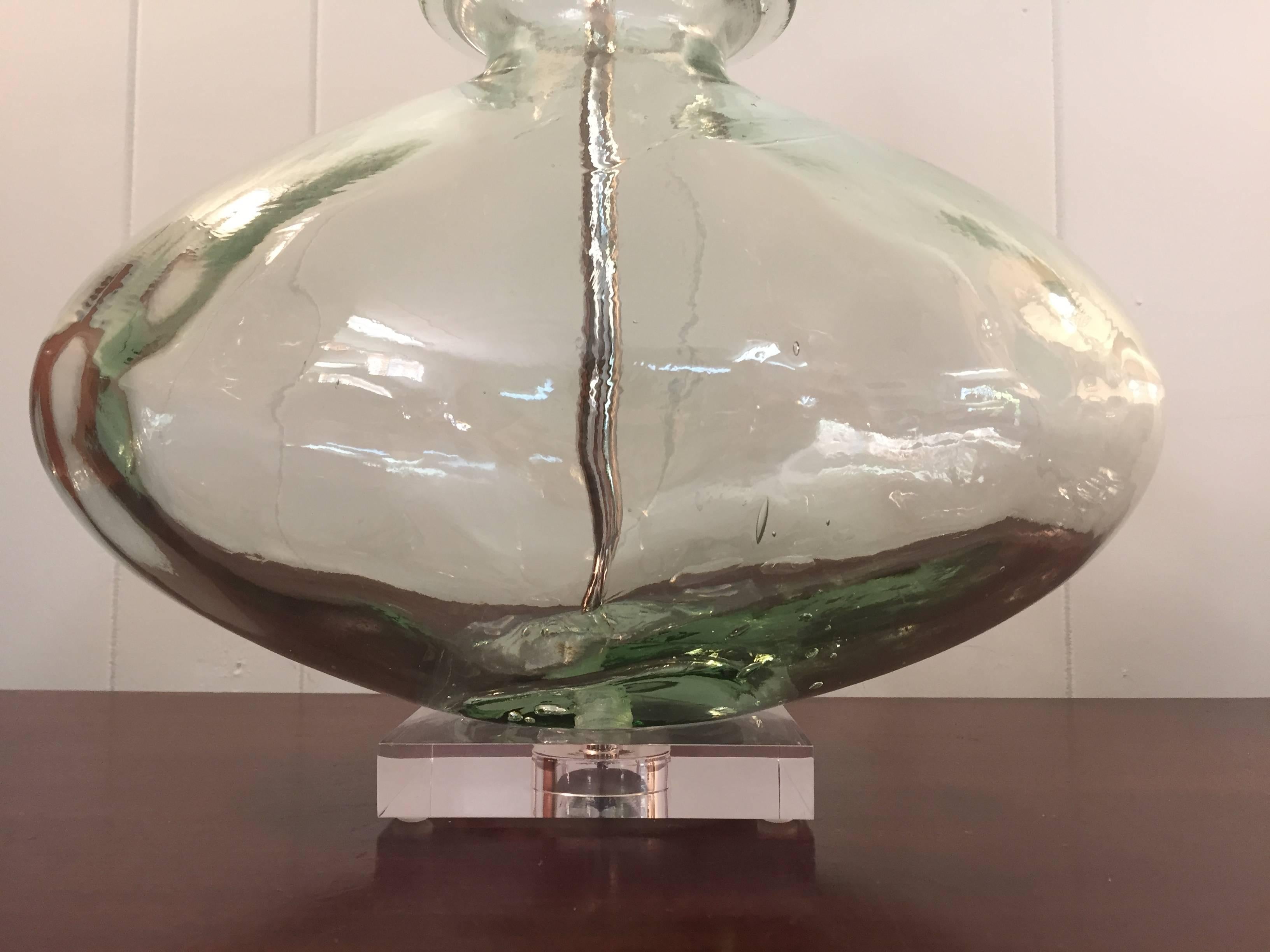Offered is a gorgeous, 1970s pale-green blown glass lamp. The piece has all new custom Lucite cap and base, new wiring, and three-way socket. The pale-green resembles a blue or green sea-glass coloring.