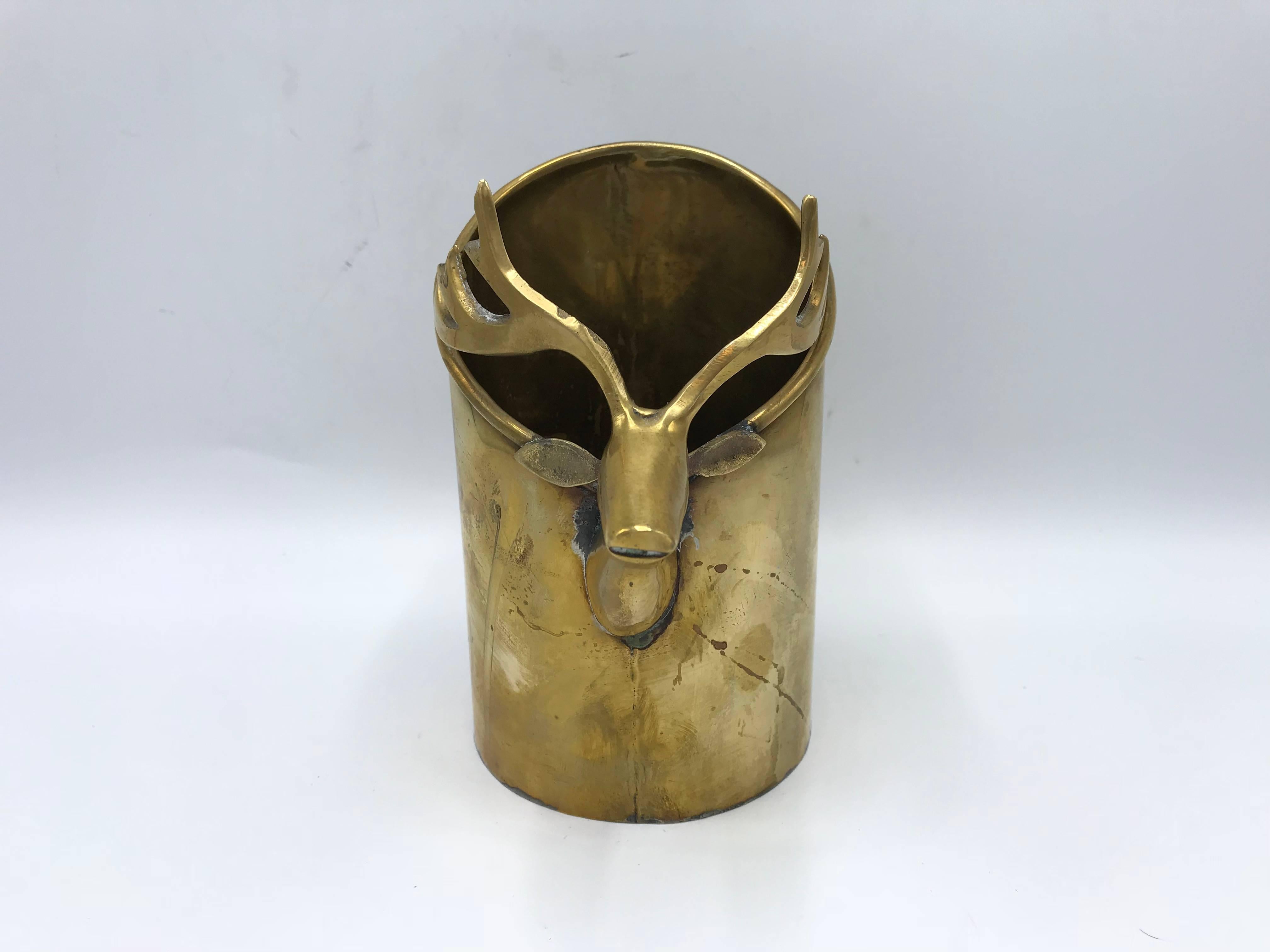 Offered is a fun and festive, 1970s brass wine chiller with a deer sculpture on the frontside. Perfect for the holidays and festive table settings!