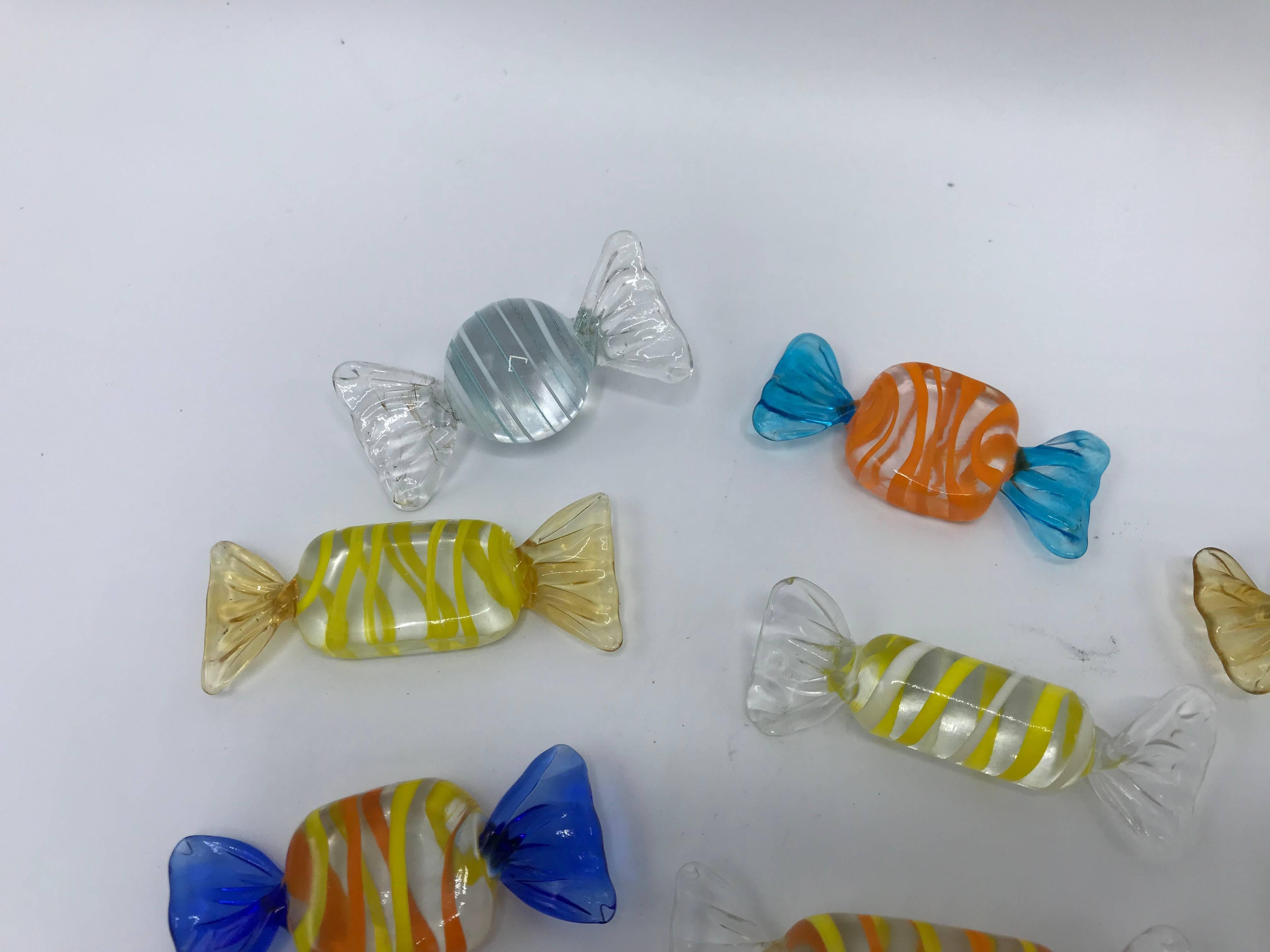 Offered is a beautiful, set of 11, 1970s Italian Murano blown-glass candy sculptures. Variety of shapes and sizes.