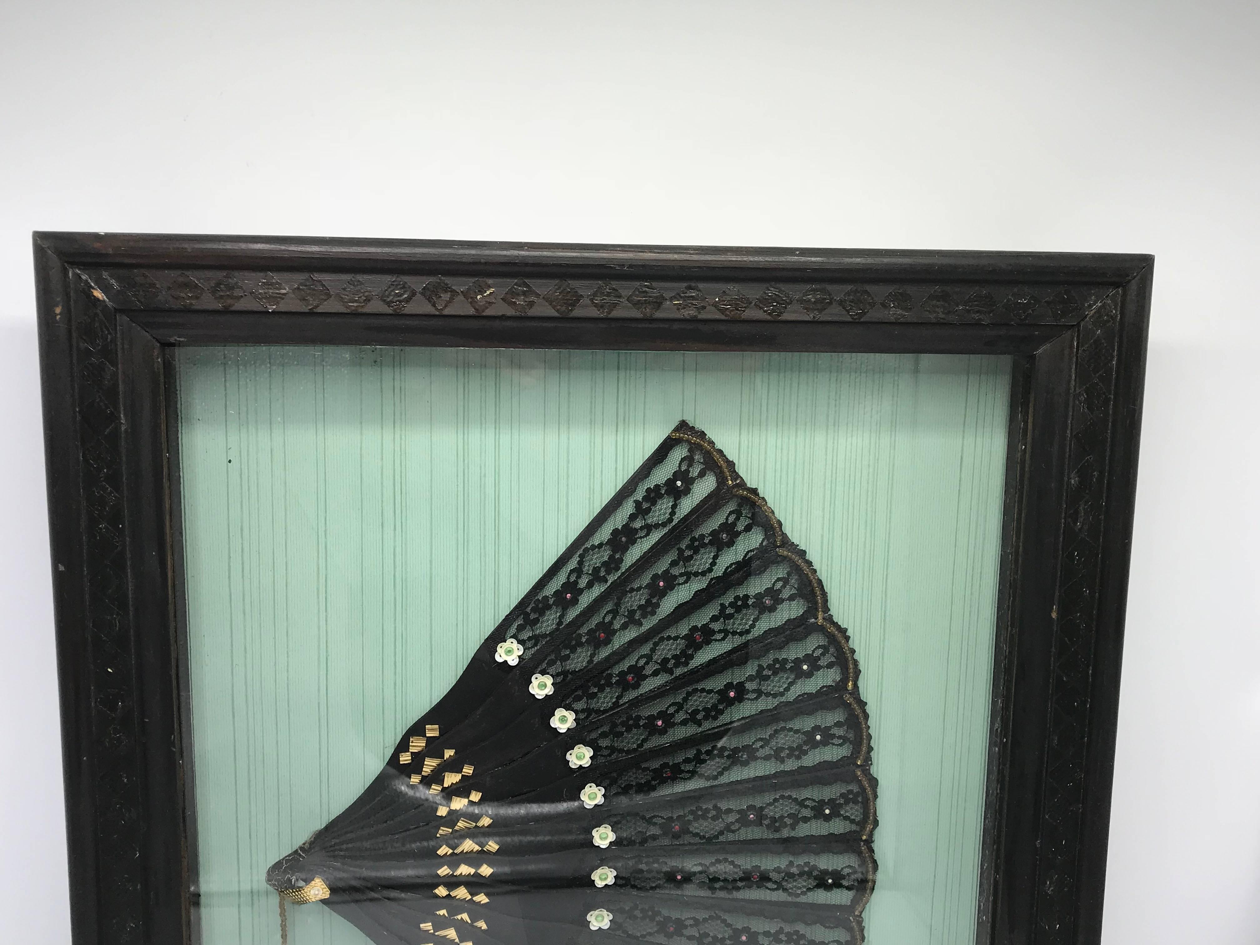 Offered is a gorgeous, 19th century Victorian hand-fan. The piece is black with sequins all-over. Framed in a shadow box.