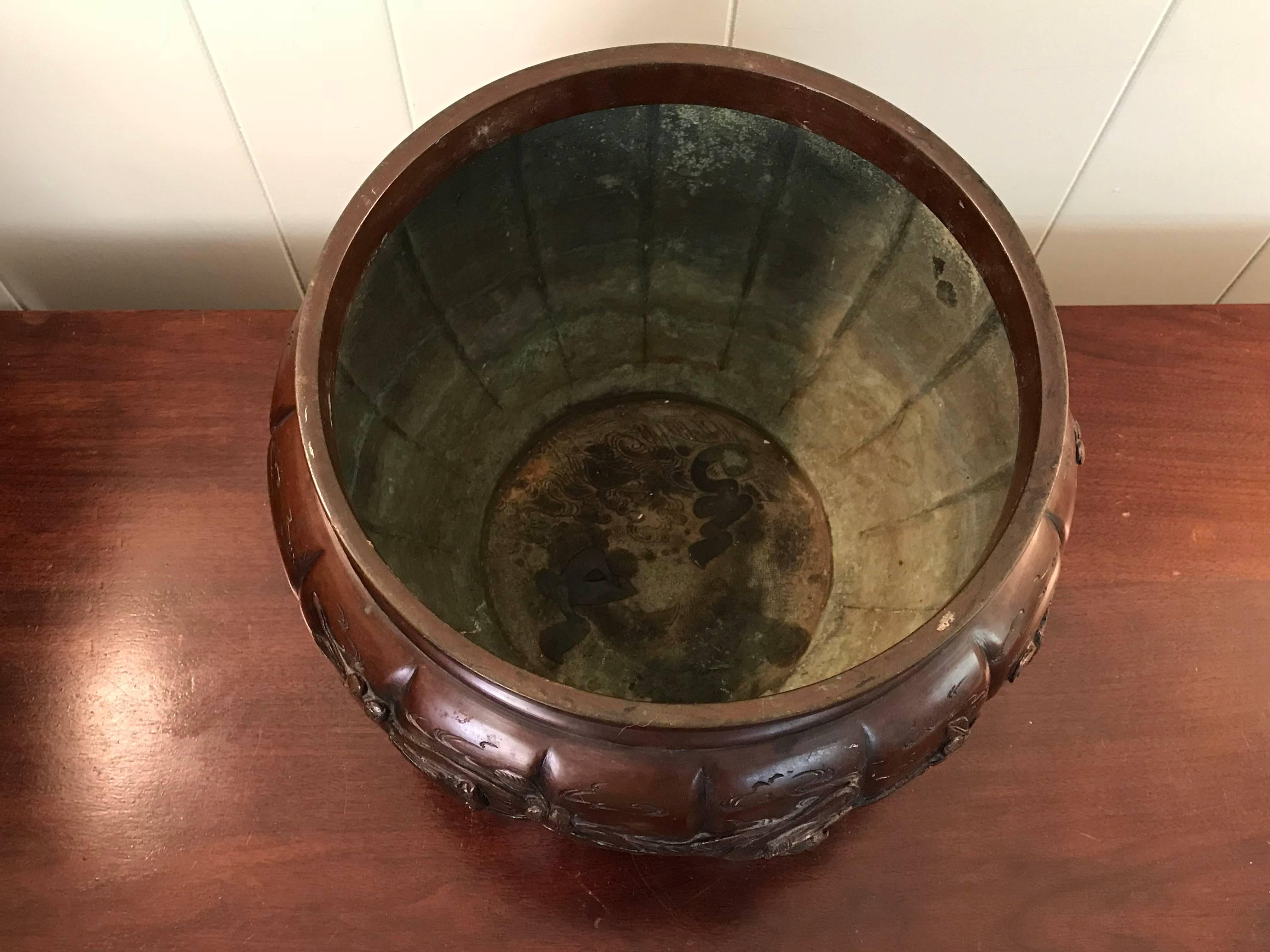 Offered is an exquisite, 19th century Meiji period, solid-bronze cachepot planter. The piece has a gorgeous, bird and tree motif that wraps around. Markings inside and on underside. 

