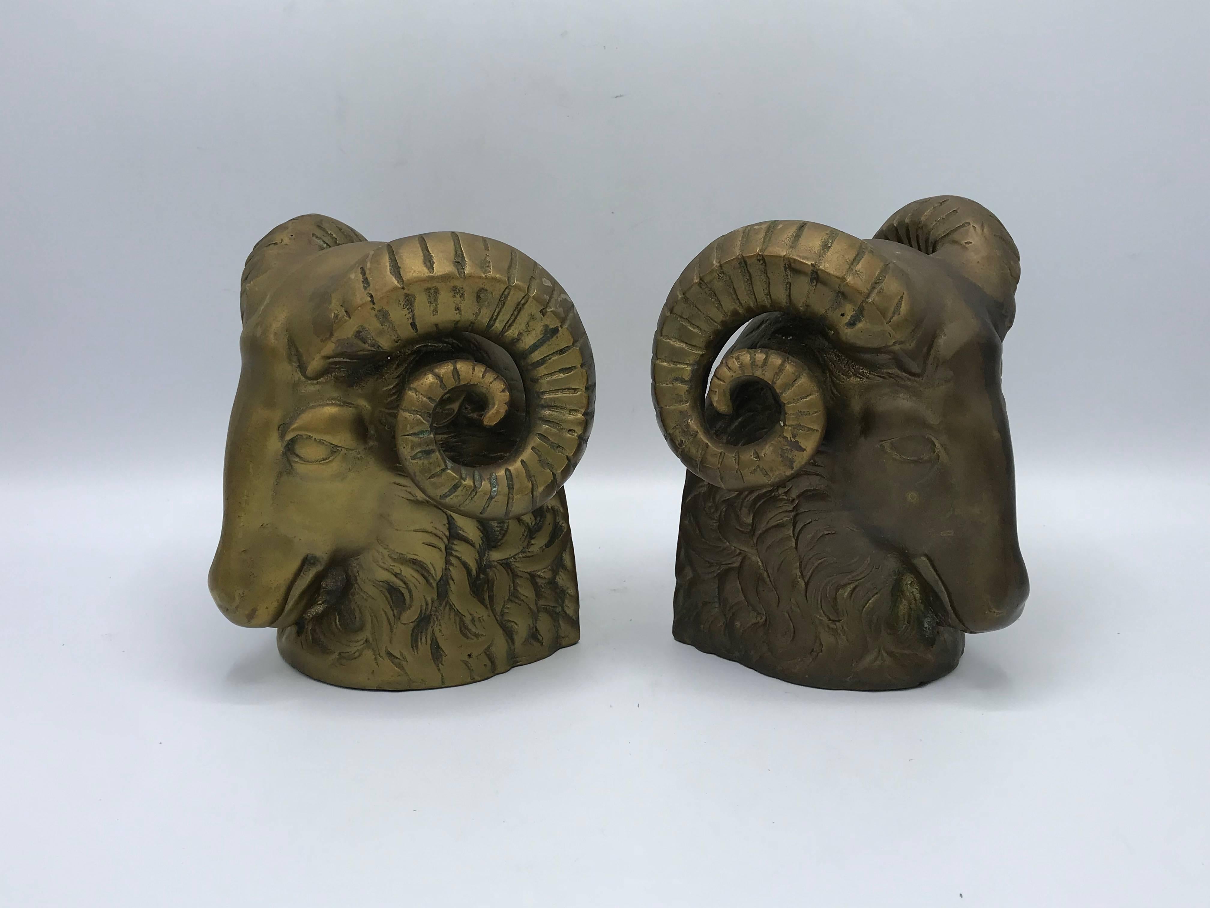 Offered is a pair of 1970s brass ram's head sculpture bookends. Heavy, 6 pounds each.