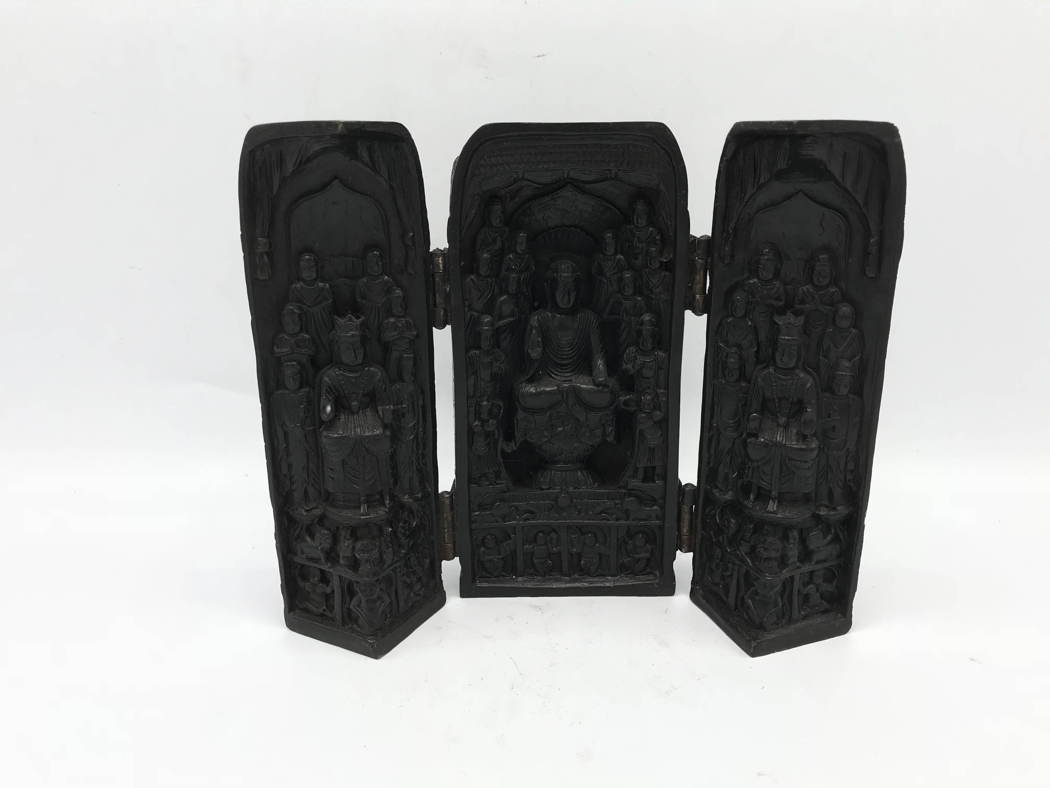 Offered is an exquisite, 1970s, Asian temple shrine sculpture. The piece is made of solid, carved resin with a trifold hinged front. Hinges all work smoothly. When shut, it resembles a decorative box.
Measures:
When closed: 3.25