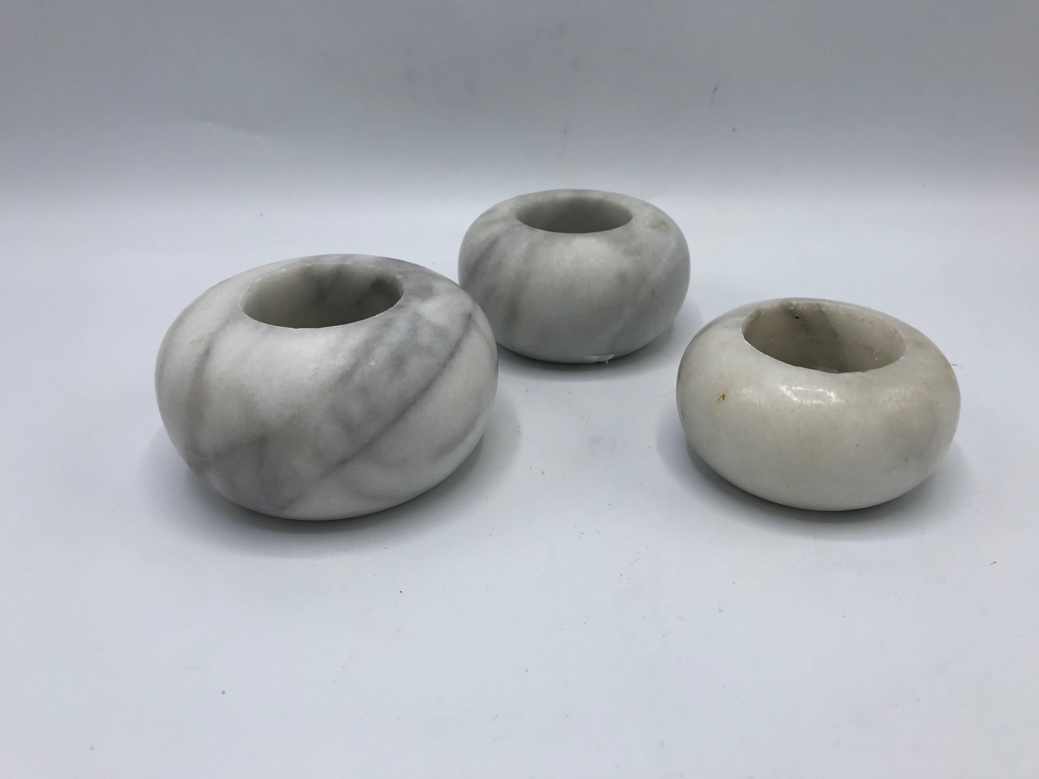 Offered is a fabulous, set of three, 1960s Italian white marble votive candleholders. Set of three descend in size. Heavy.
Measures:
Large 3.75" x 2"
Medium 3.5" x 1.75"
Small 3" x 1.5".