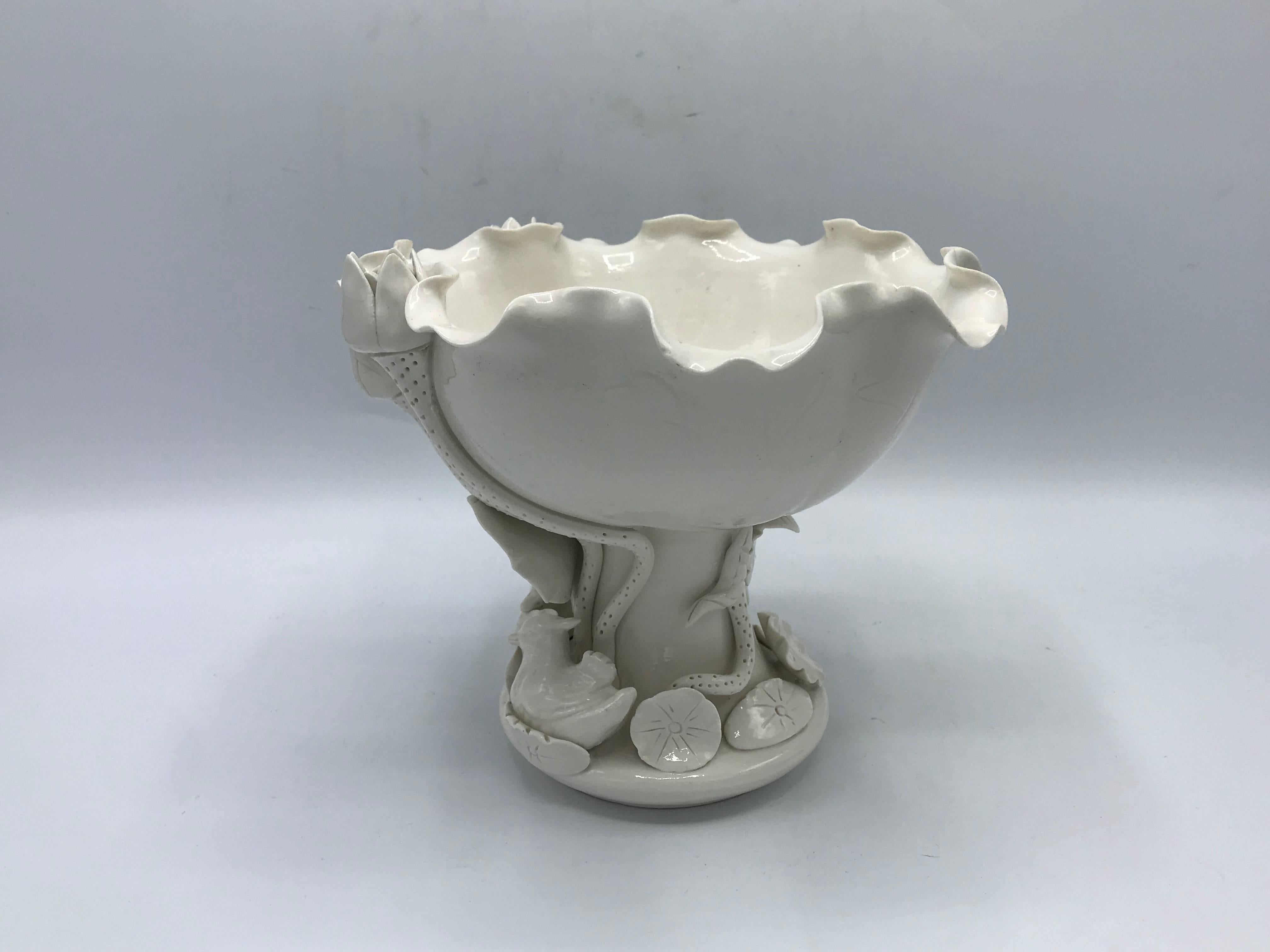 Offered is a stunning, 1960s Italian Blanc de Chine porcelain cachepot bowl. The piece has a beautiful floral motif of lotus flowers and leaves with birds along the base.