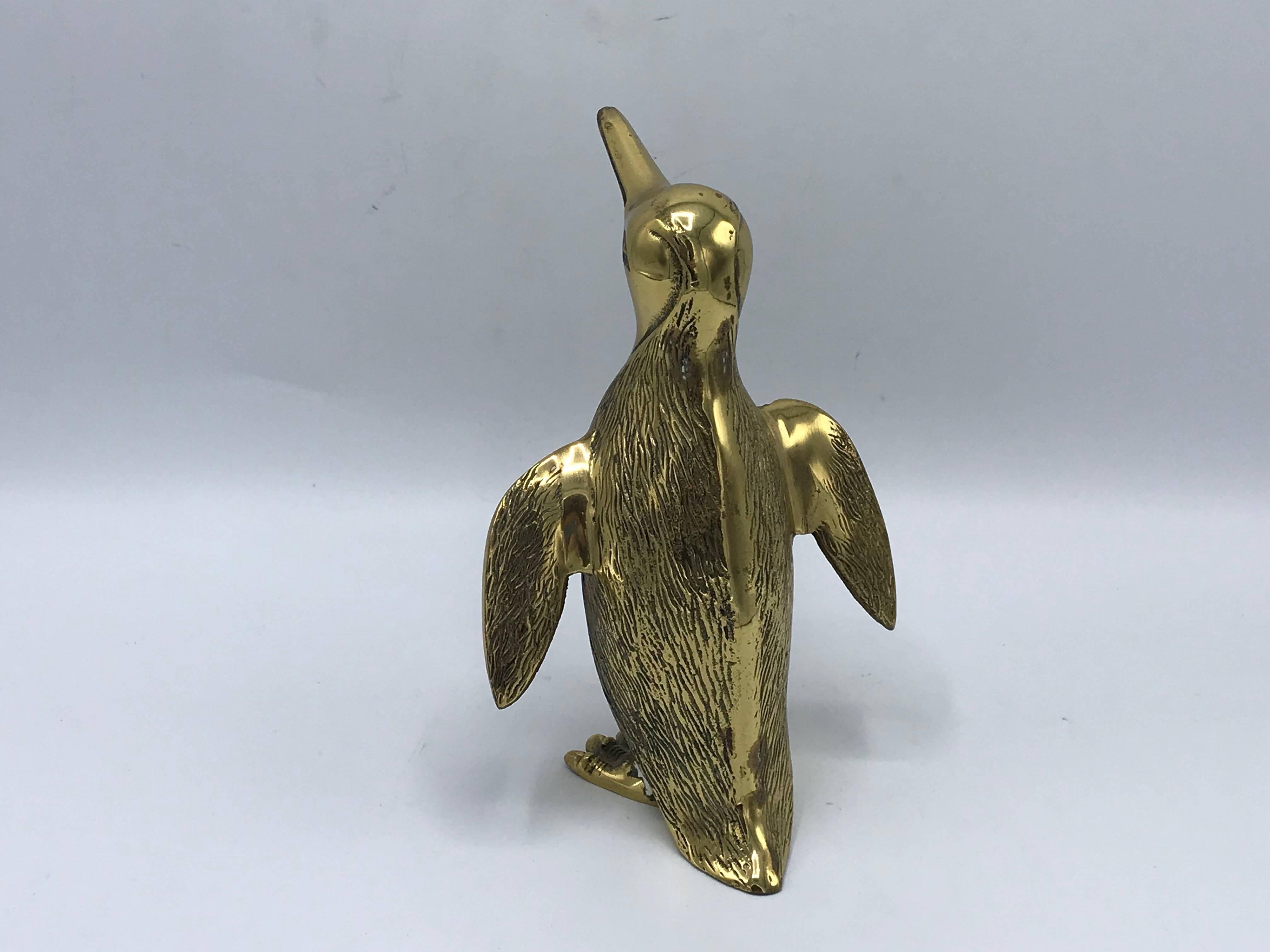 Offered is a beautiful, 1970s brass penguin bird sculpture. The piece is perfect for holiday decor!