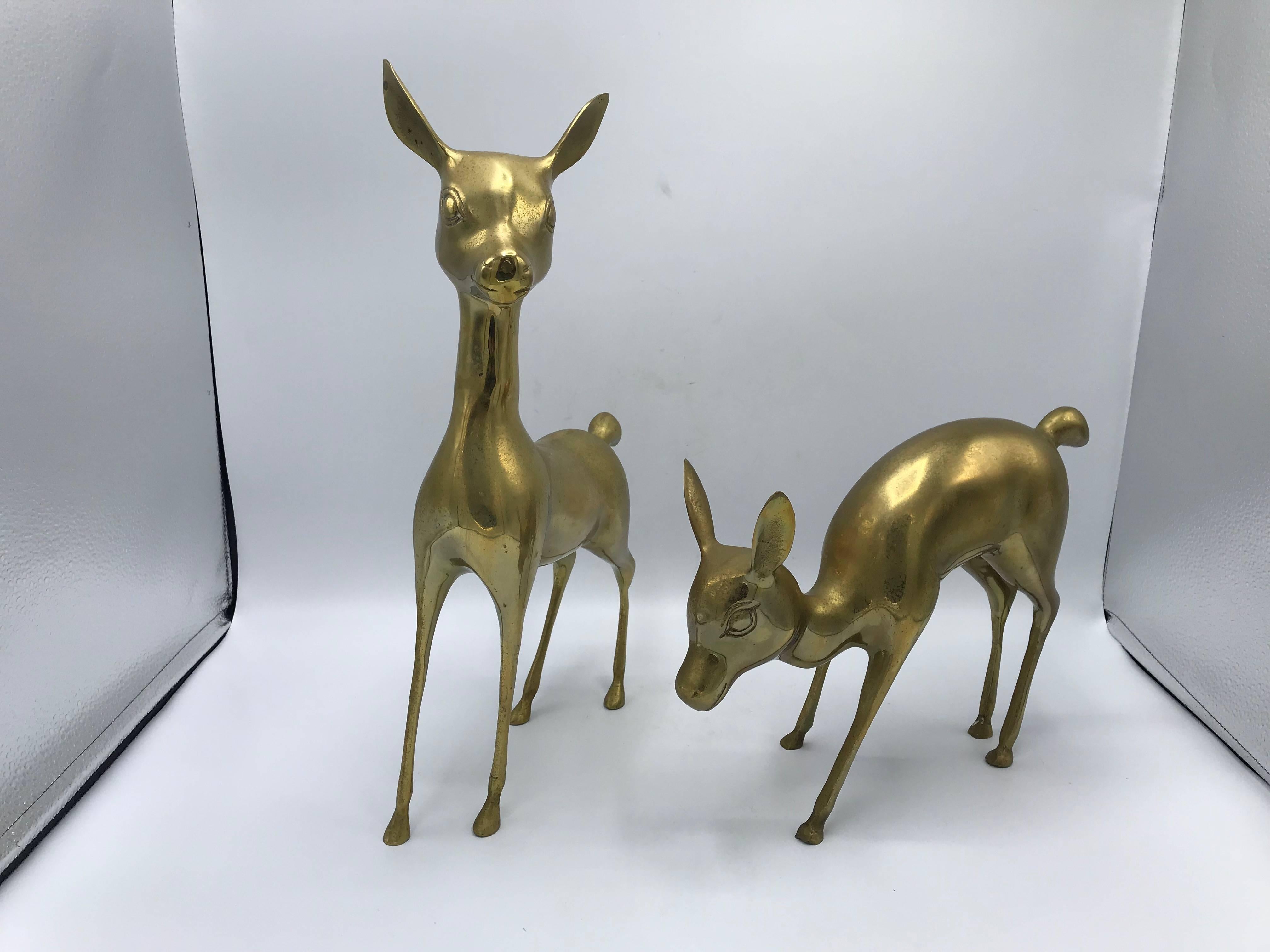 Offered is a stunning, pair of 1960s modern brass deer sculptures. These are perfect as holiday decor!