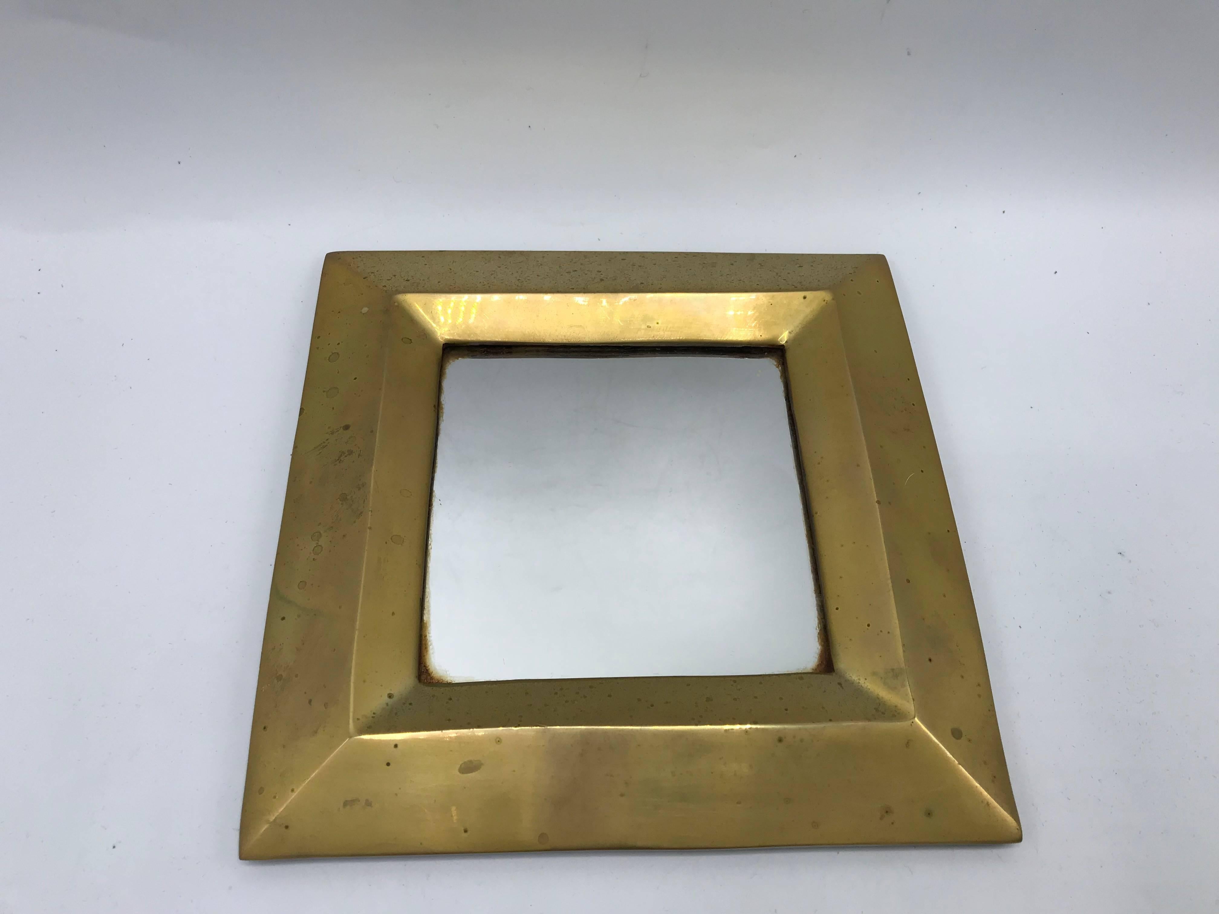 Offered is a sophisticated and modern, set of three, 1970s Italian brass geometric mirror set. Set includes; square, octagon, and circle. Each mirror is 7