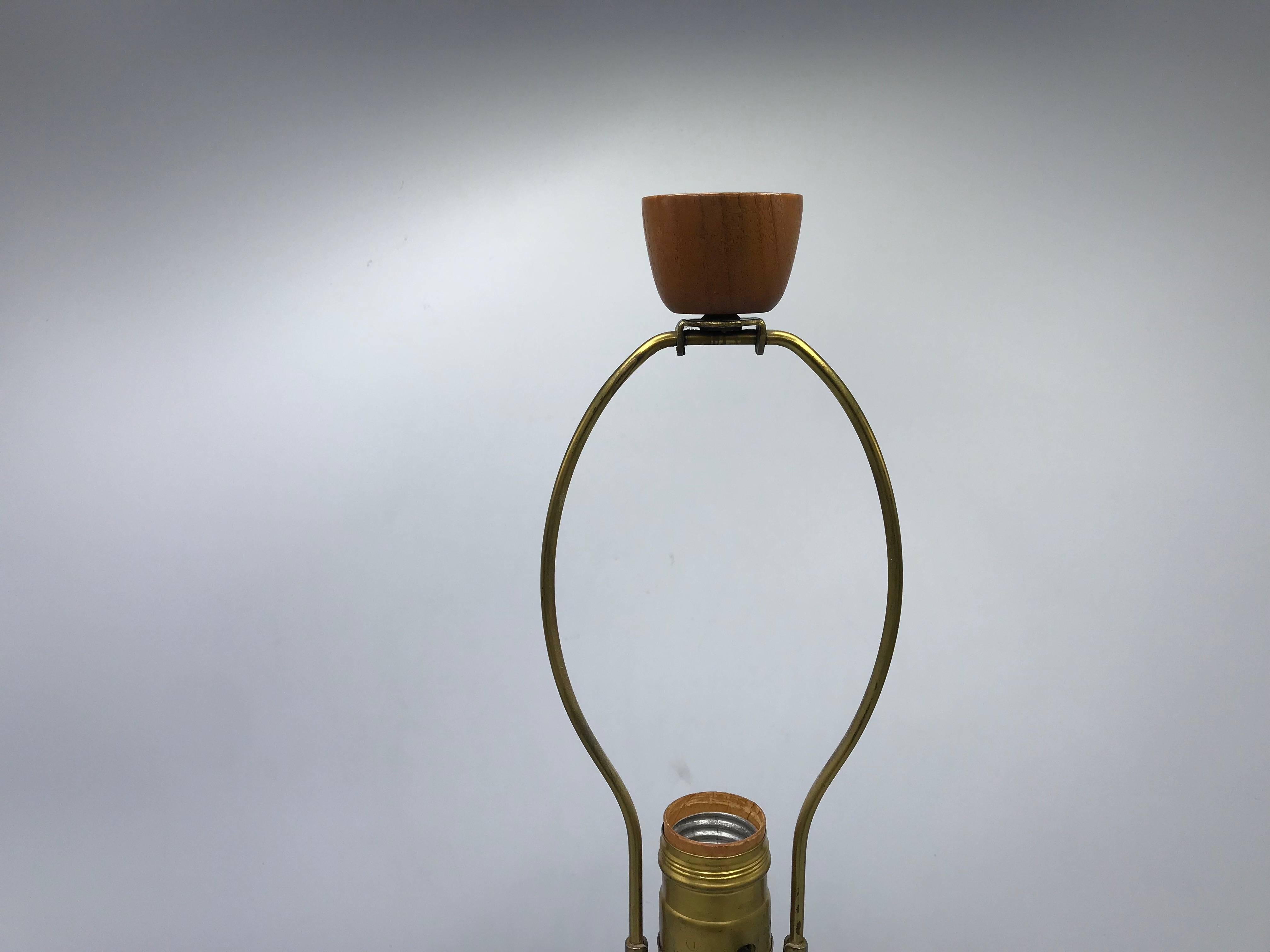 Offered is an exquisite, 1960s Gordon Martz for Marshall Studios ceramic lamp. The piece is in excellent condition, including original teak finial. Measure: 17