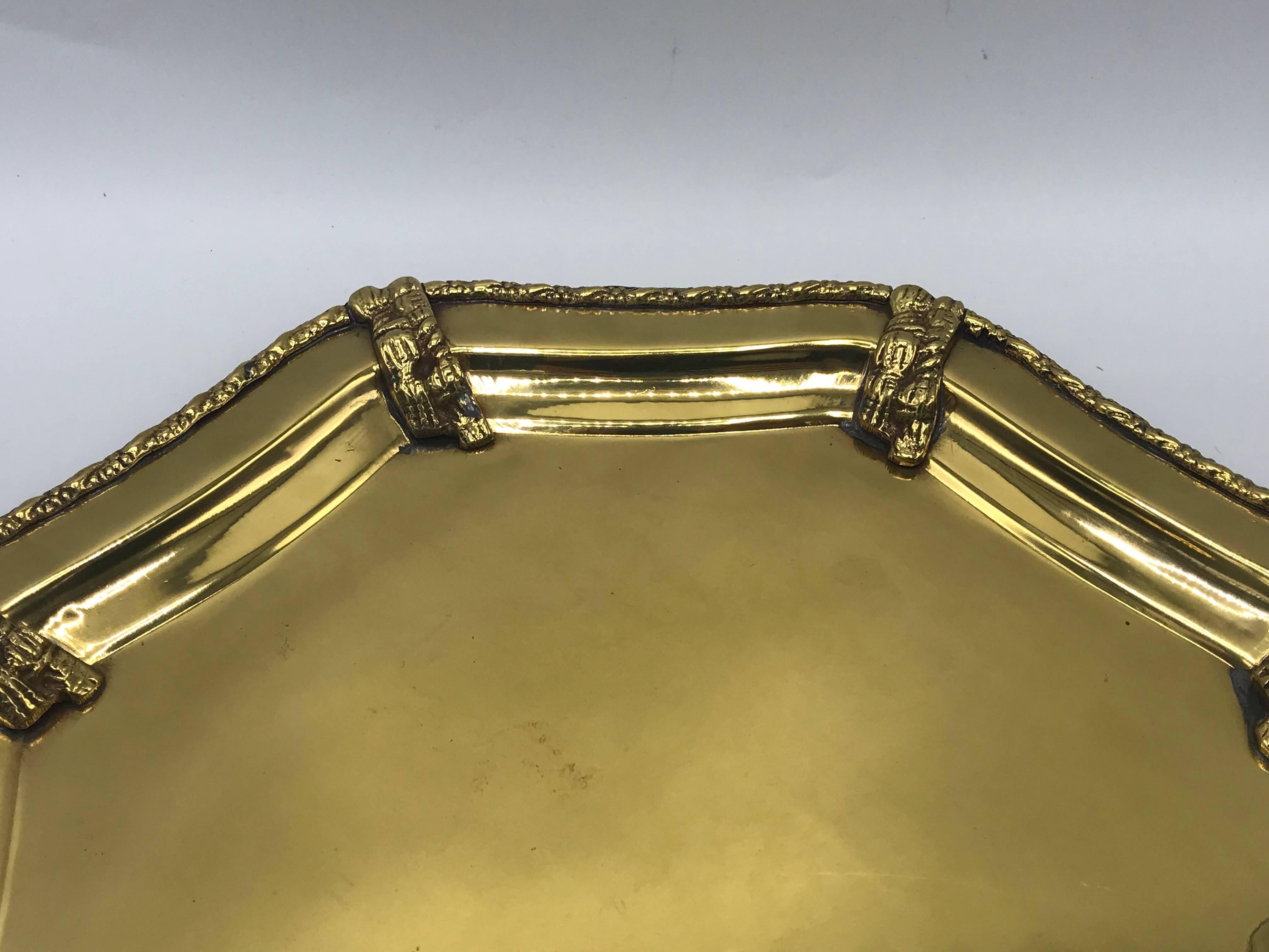 Offered is a large and stunning, 1960s, Italian polished brass octagonal tray with a detailed rope motif. Perfect addition to any table setting, bar, or vanity. Truly, a gorgeous piece. Heavy, solid-brass.