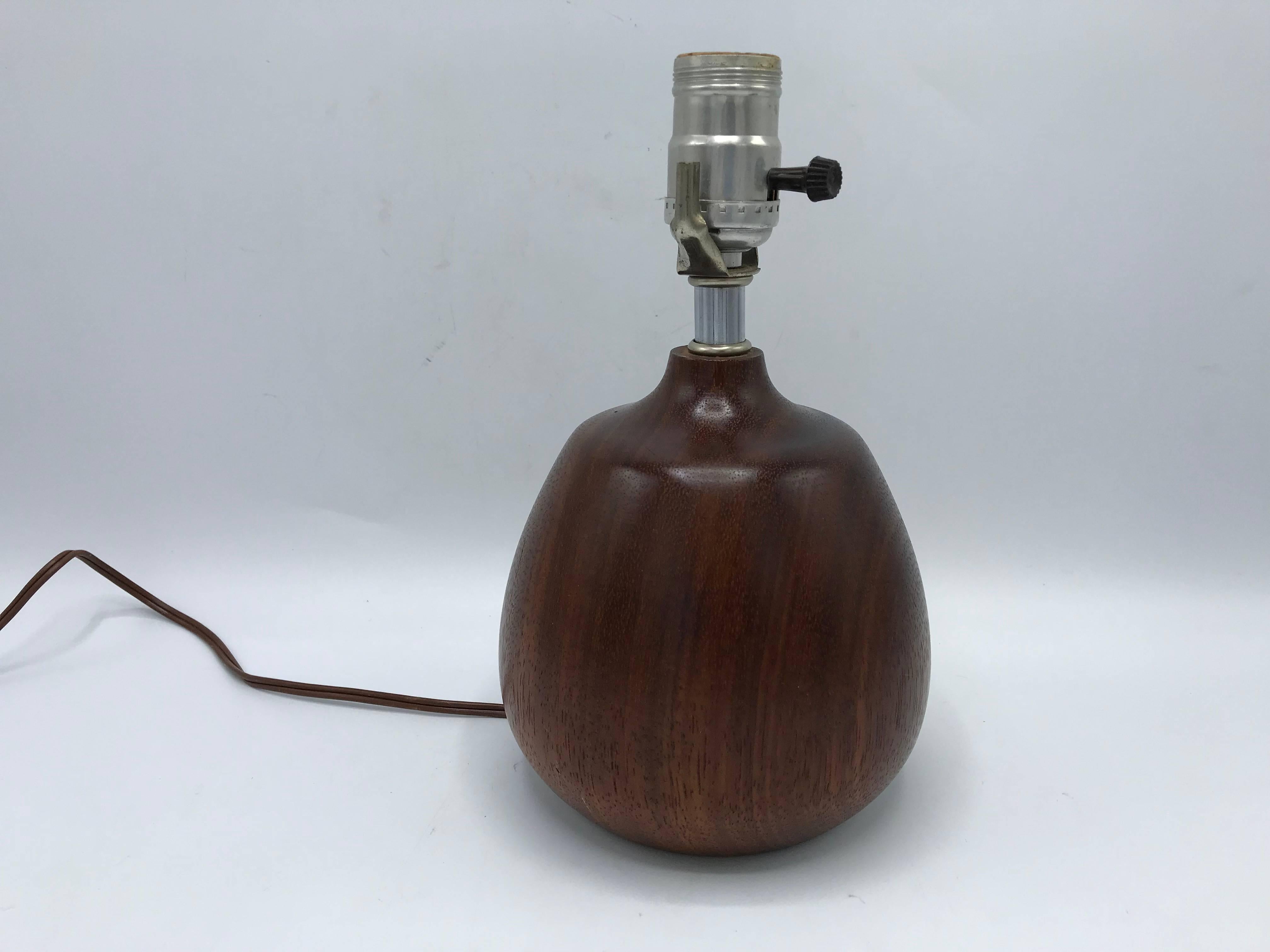 Listed is a modern and sophisticated, 1960s Danish solid-walnut lamp. Original wiring and socket, all in excellent, working condition.