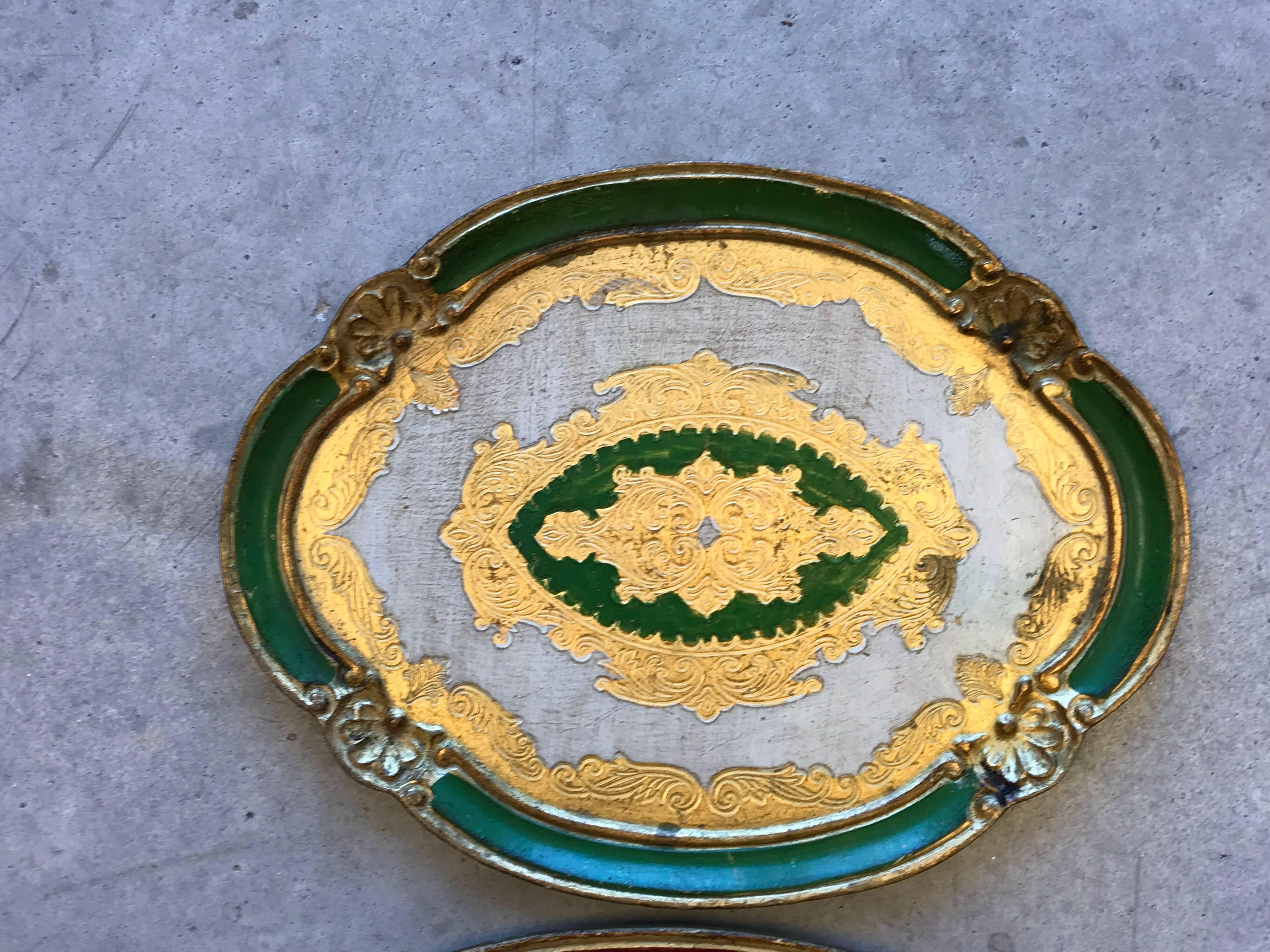 Listed is a fabulous, set of three, 1960s Italian Florentine trays. The set nests into one another. Green, red and blue. 

Measures: Green, small 0.75