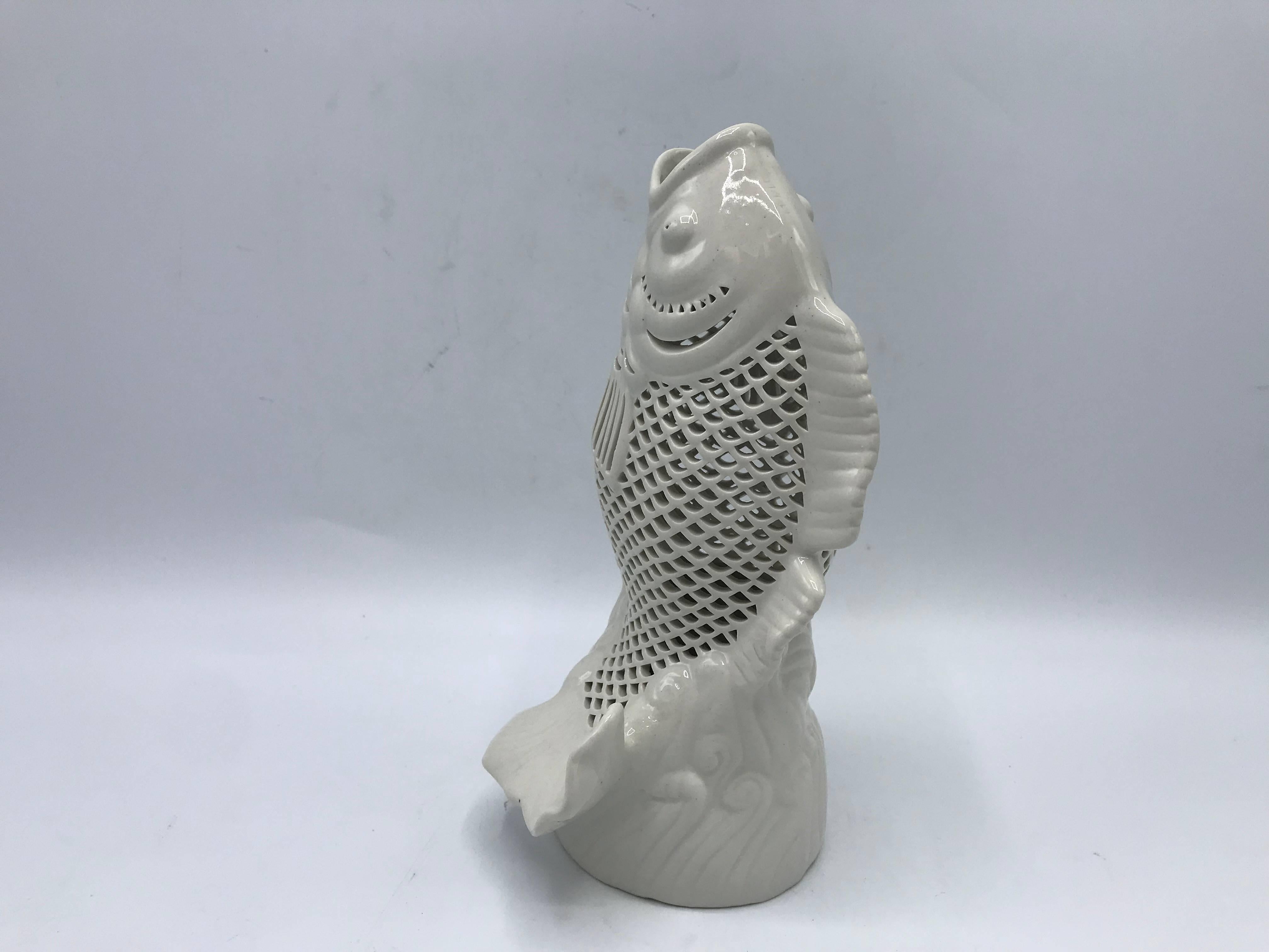 Offered is a fabulous, 1960s Blanc de Chine koi fish sculpture. Pure white porcelain. Pierced along the scales. Small hole underneath, allowing it to easily be converted into a lamp.