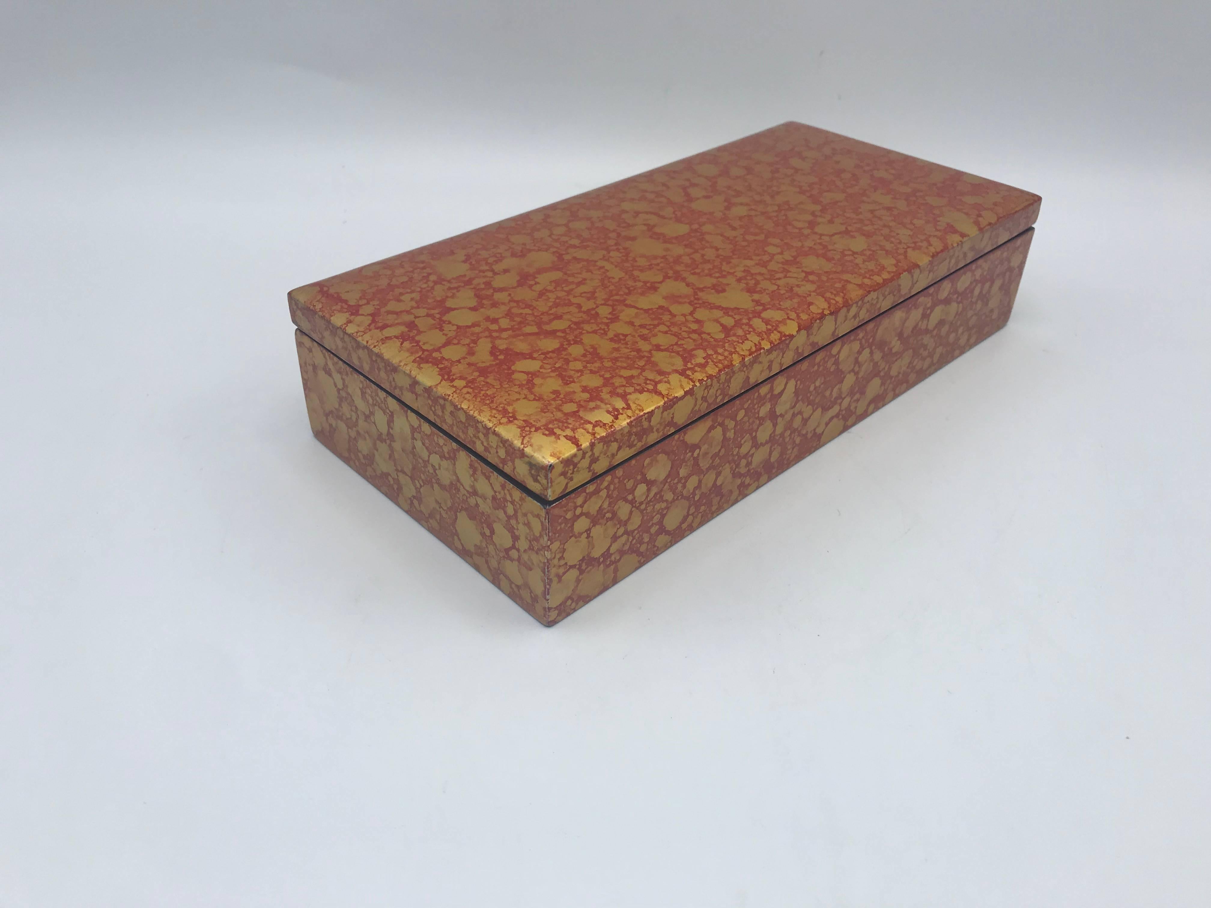 Offered is a fabulous, 1970s chinoiserie red and gold lacquered box. Hinged and lidded.