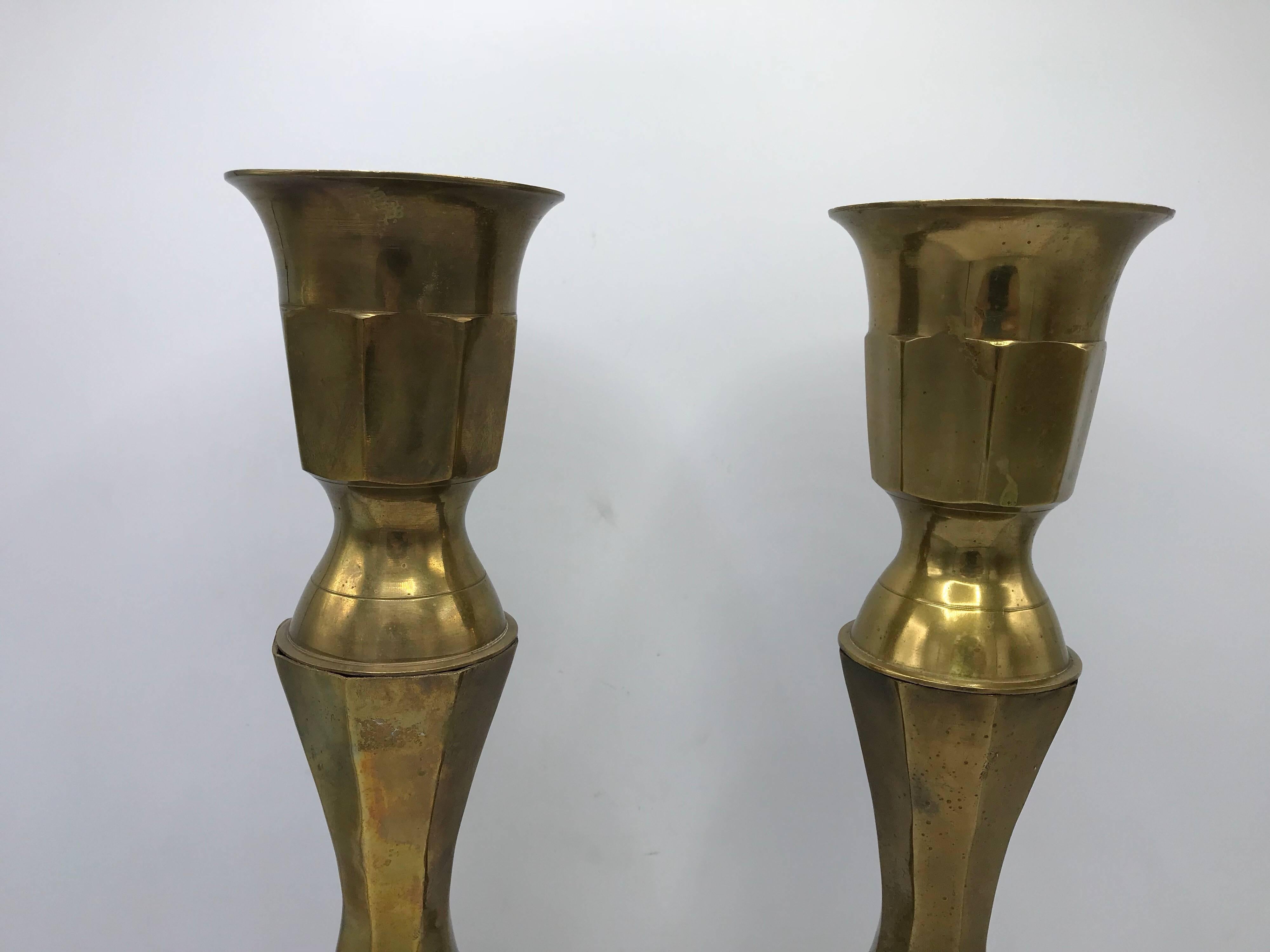 Offered is a beautiful and substantial, pair of 1950s large brass candlesticks. Lovely all-over patina.