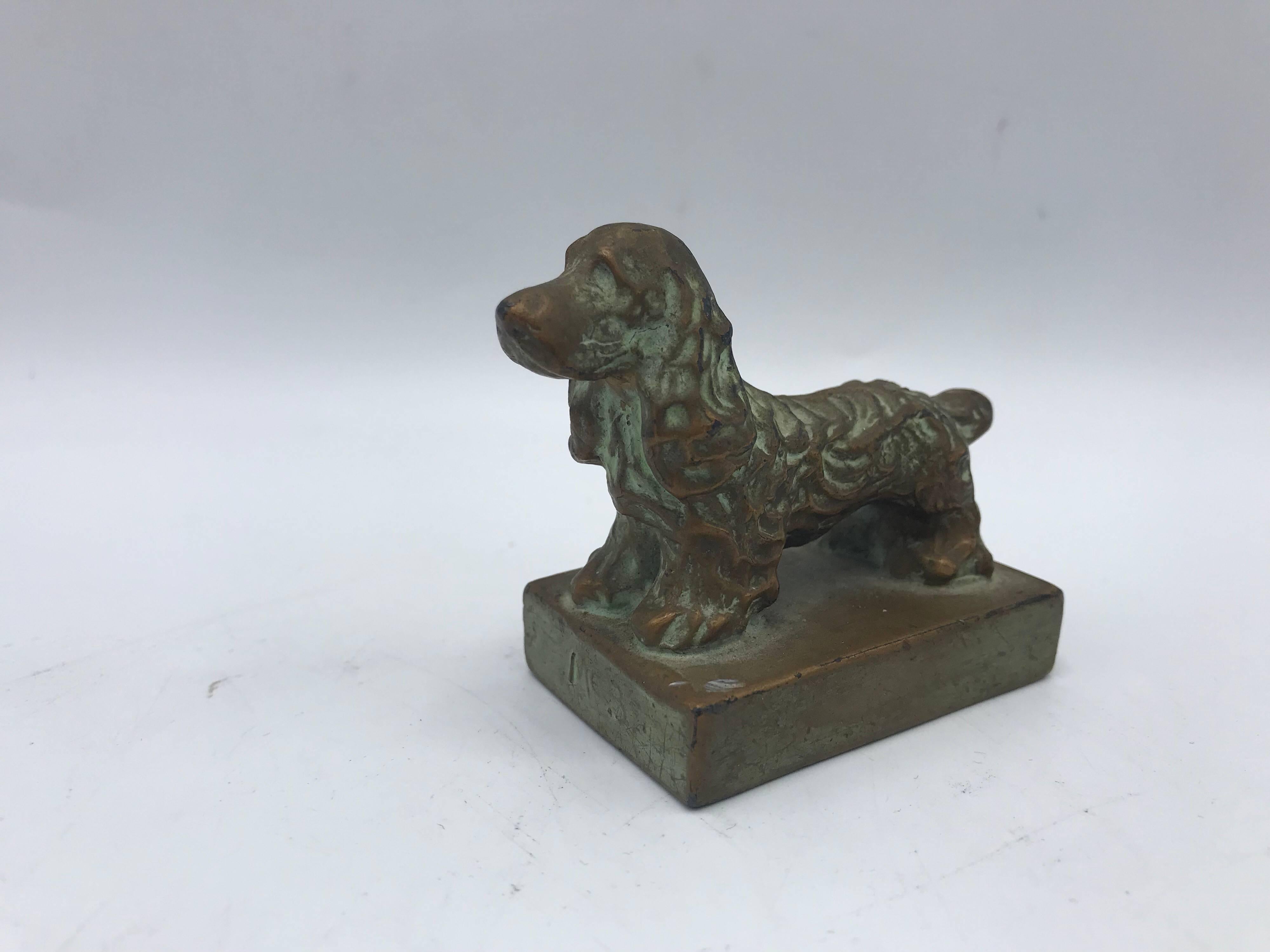 Listed is a beautiful, 1920s solid-bronze, Spaniel dog sculptural paperweight. The perfect addition to any canine collection!