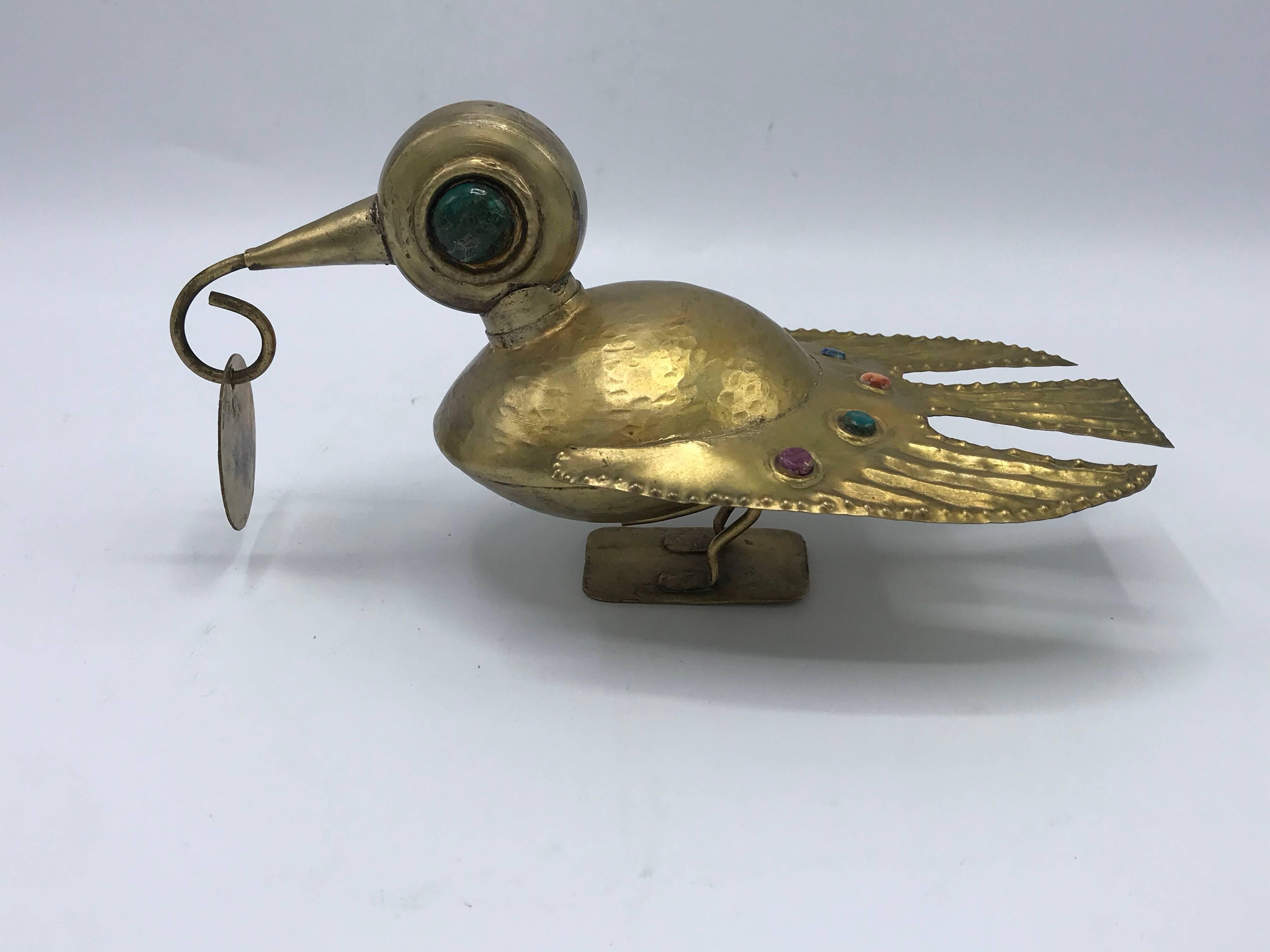 Offered is a lovely, 1970s Mexican hammered-brass bird sculpture with simulated cabuchons of amethyst, emerald, citrine, and sapphire jewels.