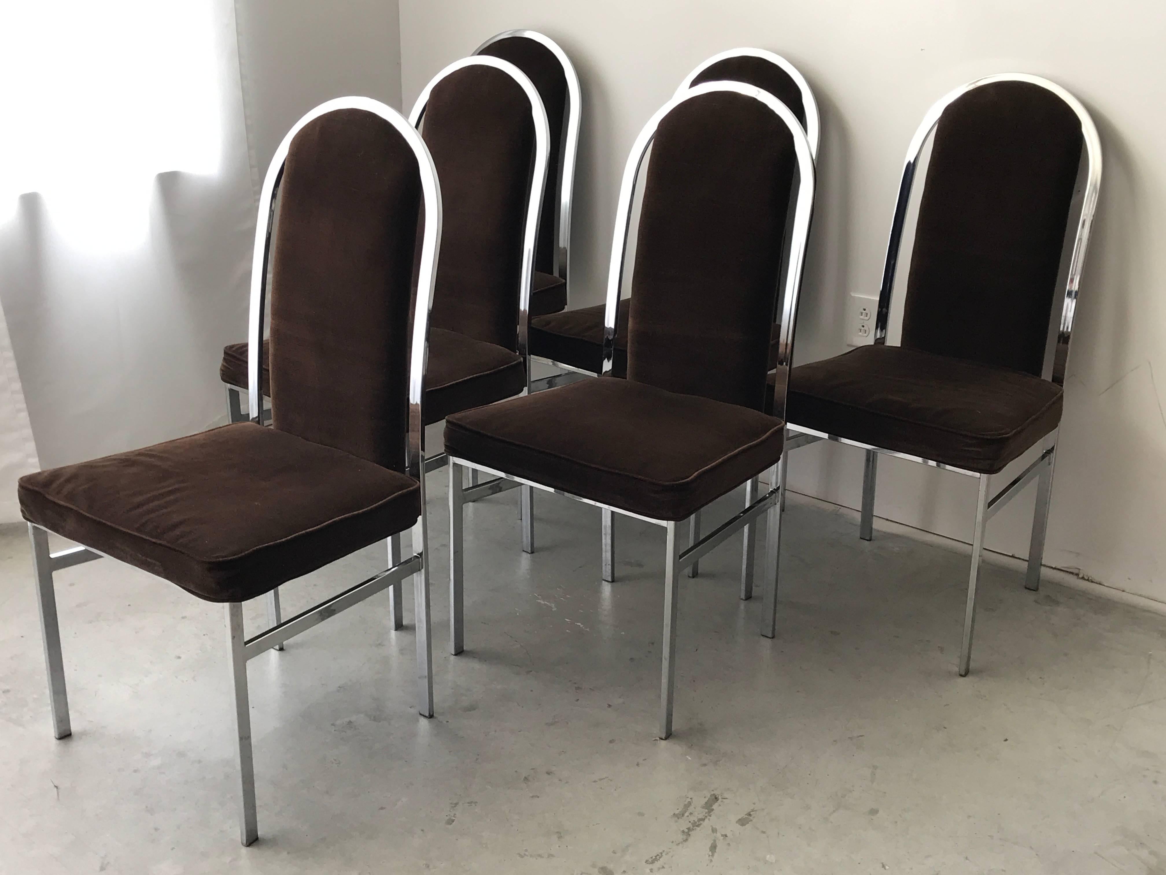 Offered is a gorgeous, set of six, 1960s Milo Baughman style chrome dining chairs by Samton. Upholstered in a chocolate-brown velvet. Fabric and foam are in good/fair condition, though will need to be reupholstered. Chrome frame is in excellent