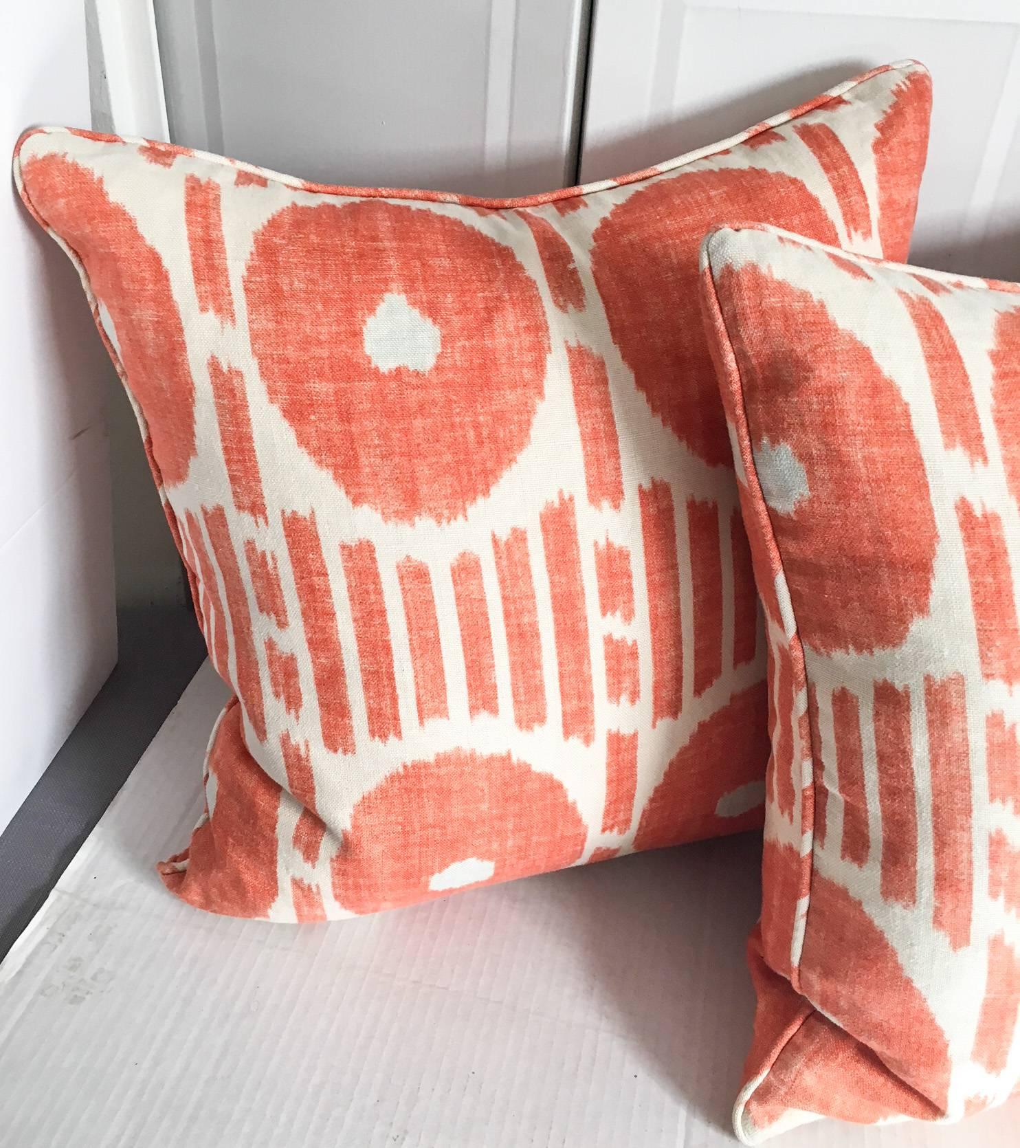 Striking pair of 100% linen cream and orange pillows in Mesa Ikat by Thibaut. Down inserts are included. Each, 20 x 20. Zipper closure.