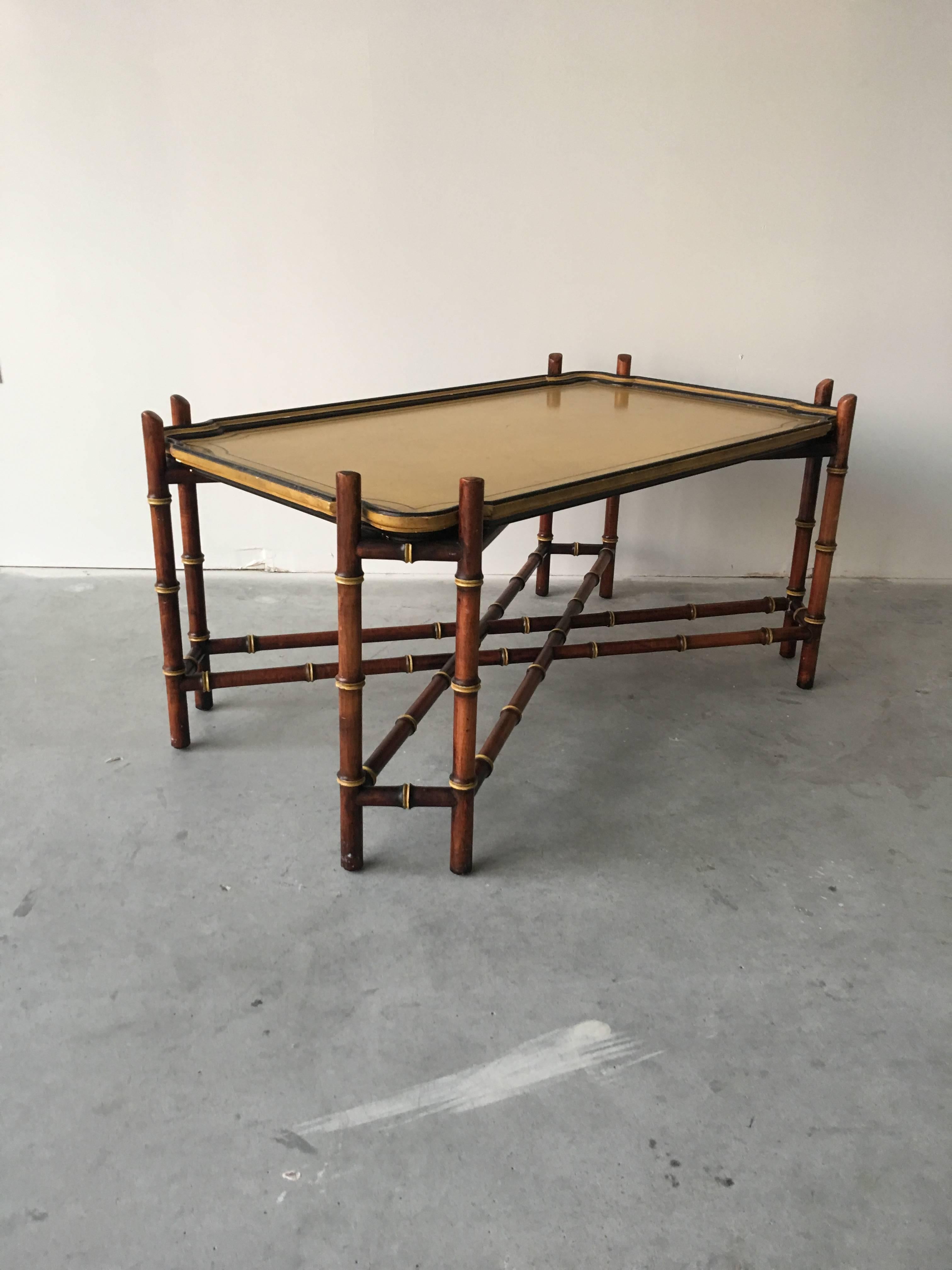 A gorgeous, baker furniture faux-bamboo tray coffee table. Removable tray.