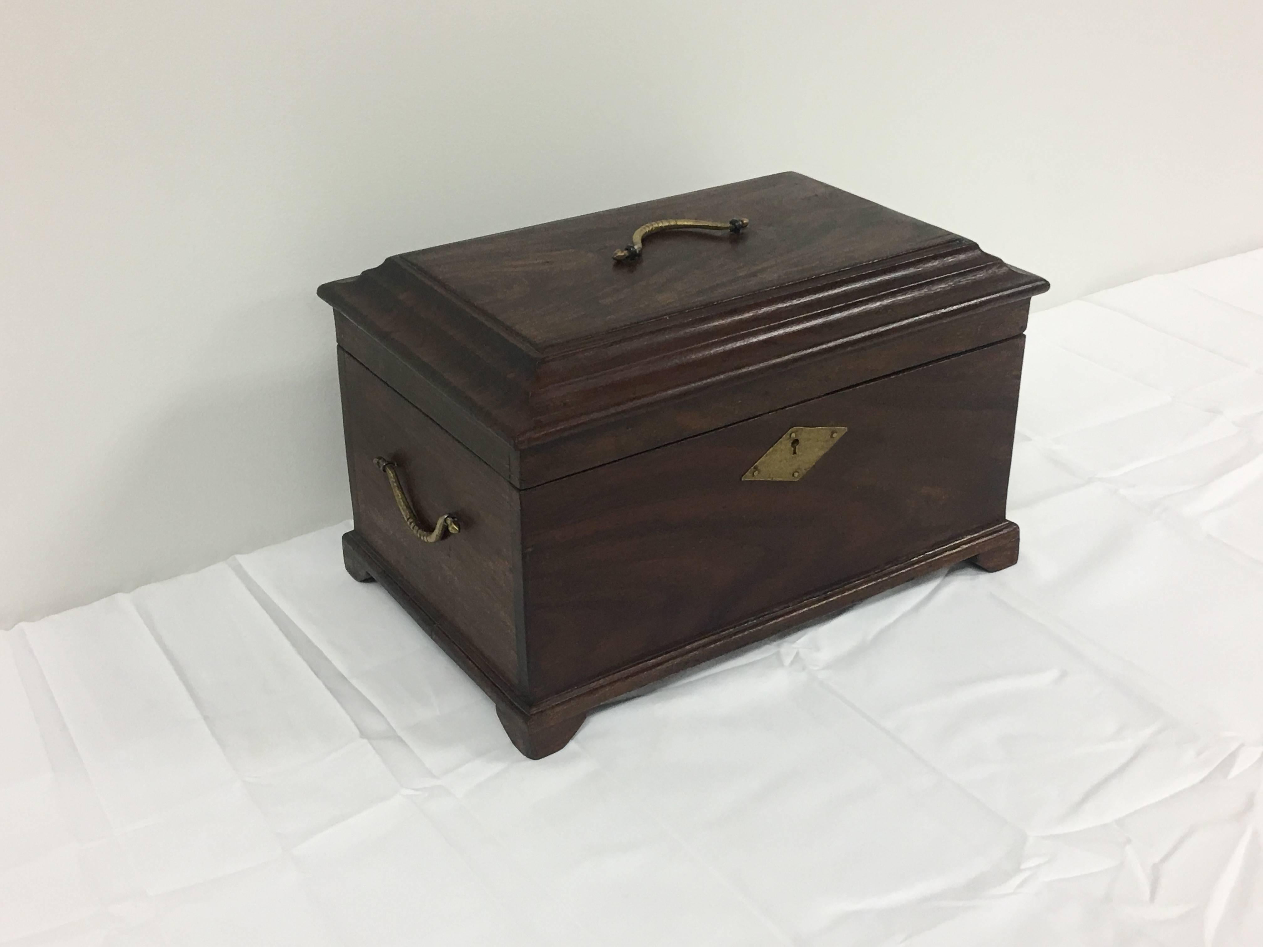 Offered is a stunning, late 19th century English mahogany tea caddy box. Gorgeous brass hardware. Includes key.