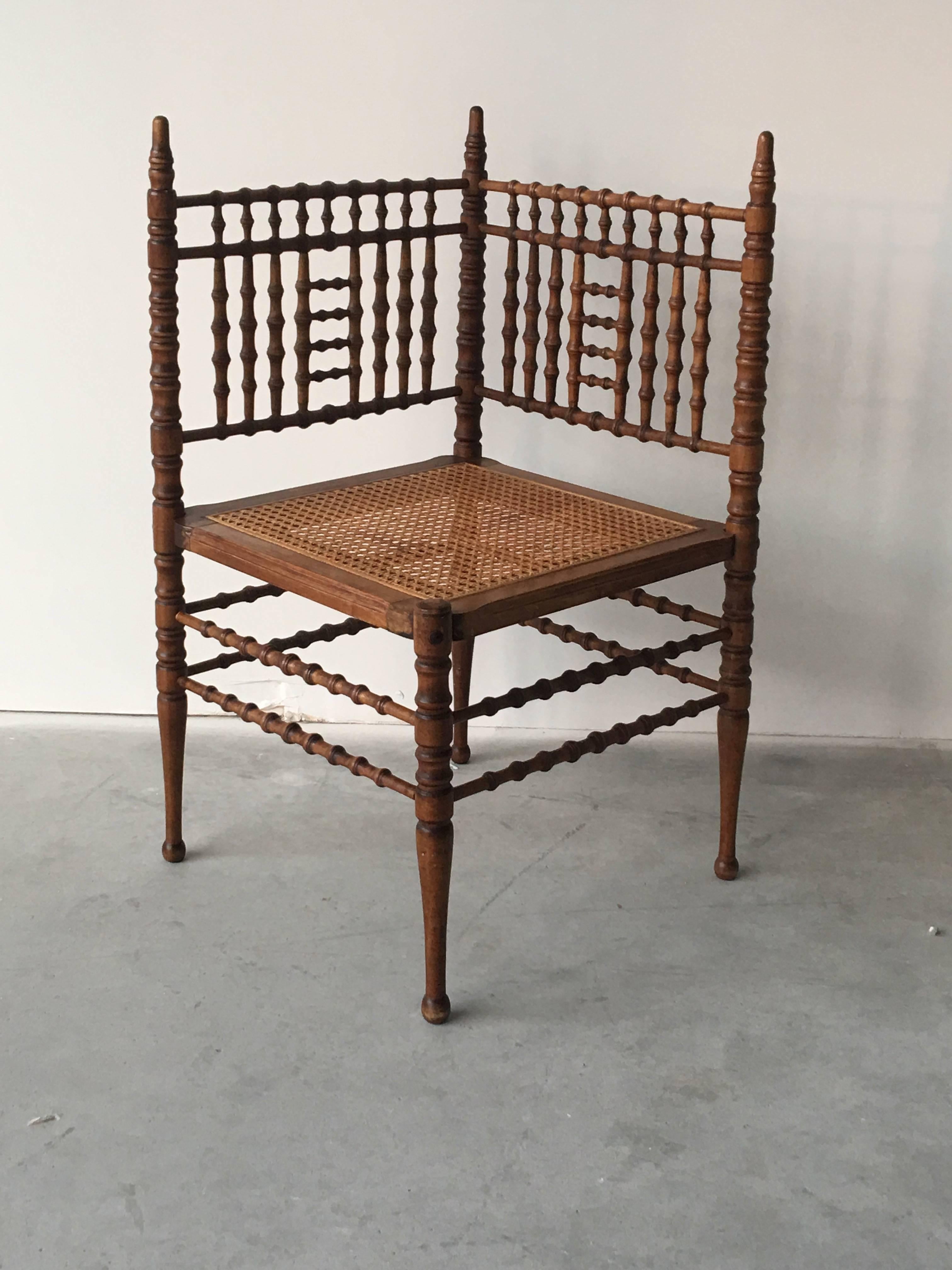 A lovely, 19th century faux bamboo and cane seat corner chair.