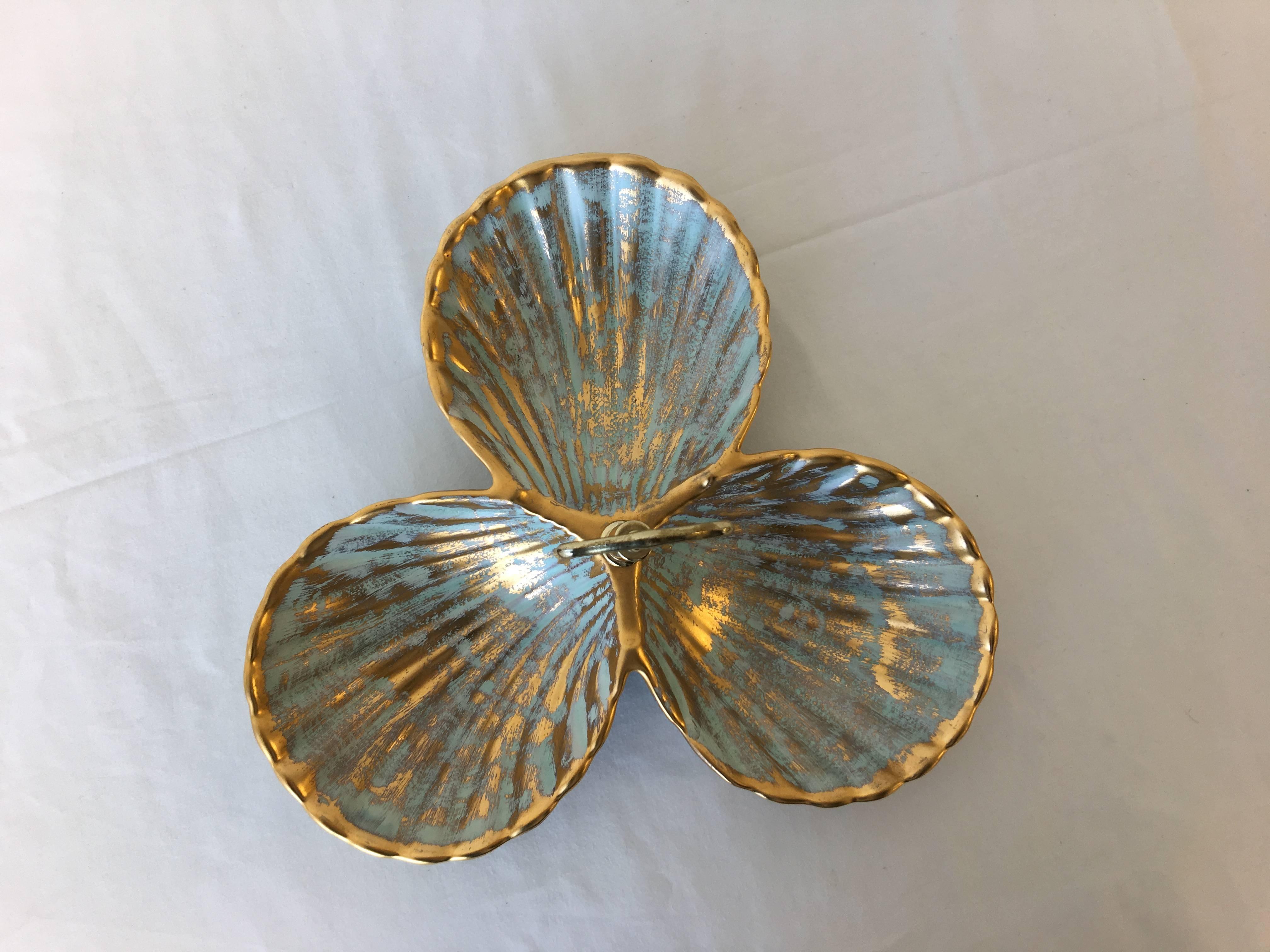 Offered is a lovely, 1970s gold and turquoise Stangl Pottery serving dish shaped as a seashell. Three separate dishes with a polished brass handle. Each dish is 6
