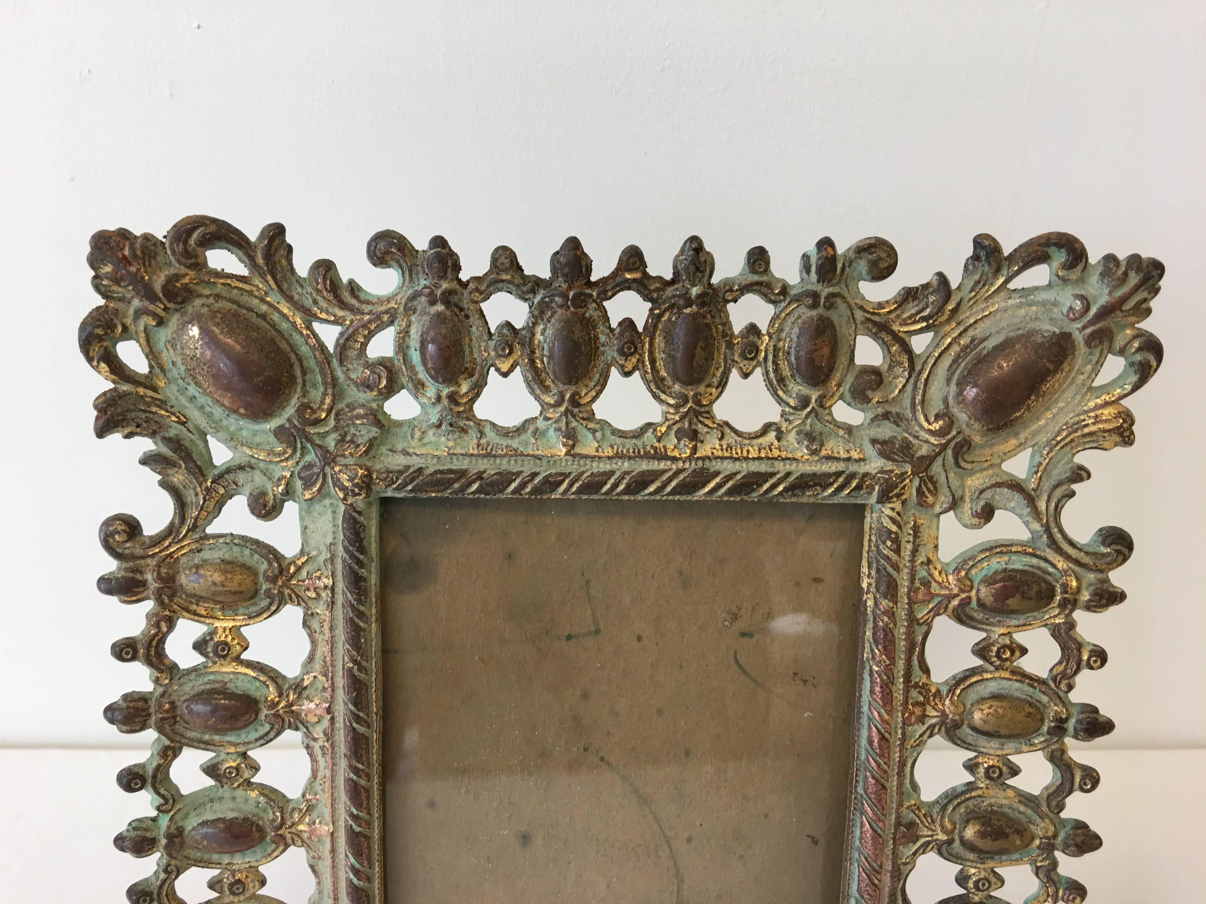 Offered is a truly stunning, 19th century, Art Nouveau standing bronze picture frame. This piece has immaculate detailing, with a flip-out stand. Fits a 4” x 6