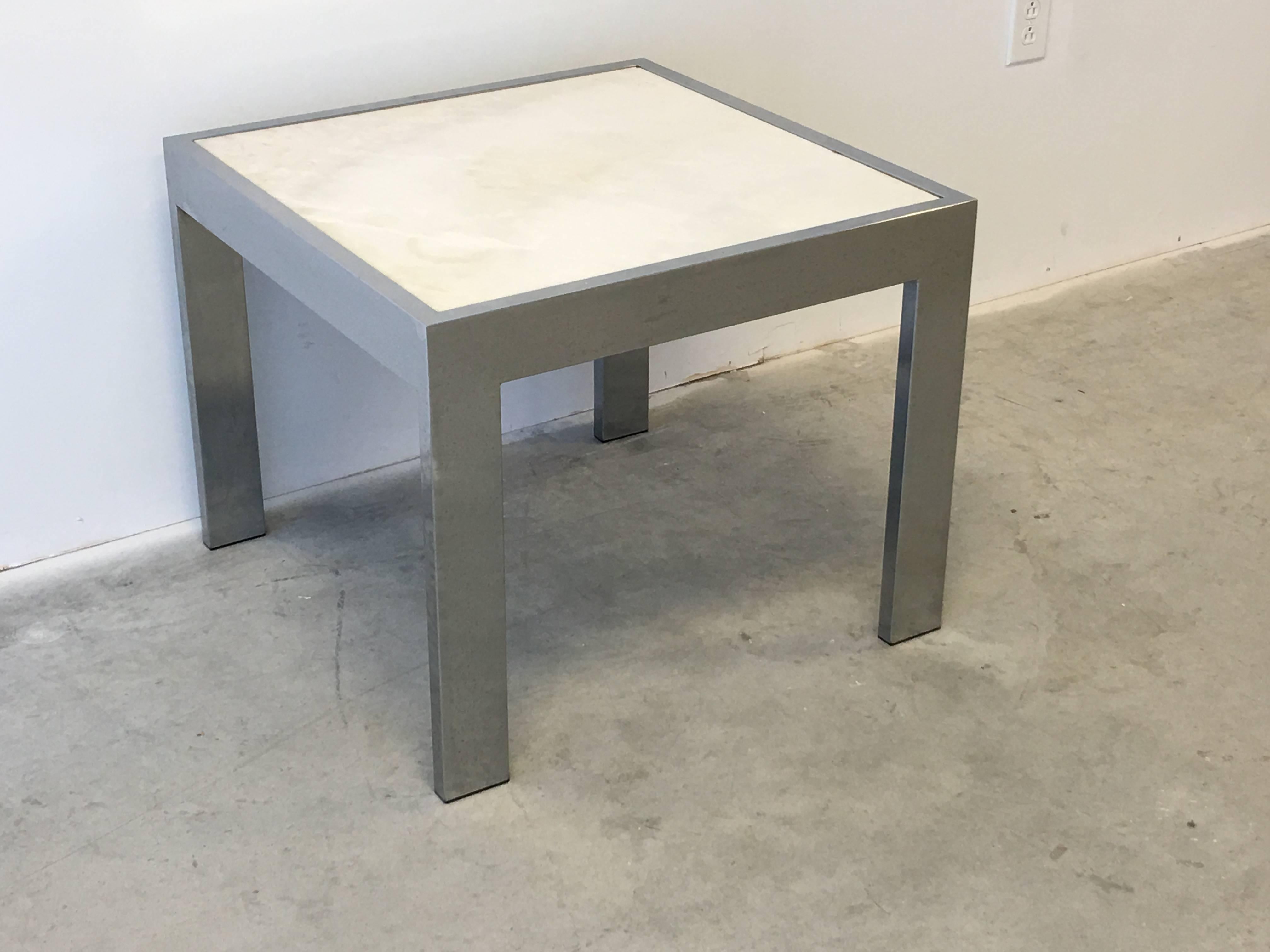 Offered is a sophisticated and elegant, 1960s Mid-Century Modern, Milo Baughman style chrome and white marble side table. Marble top is removable.