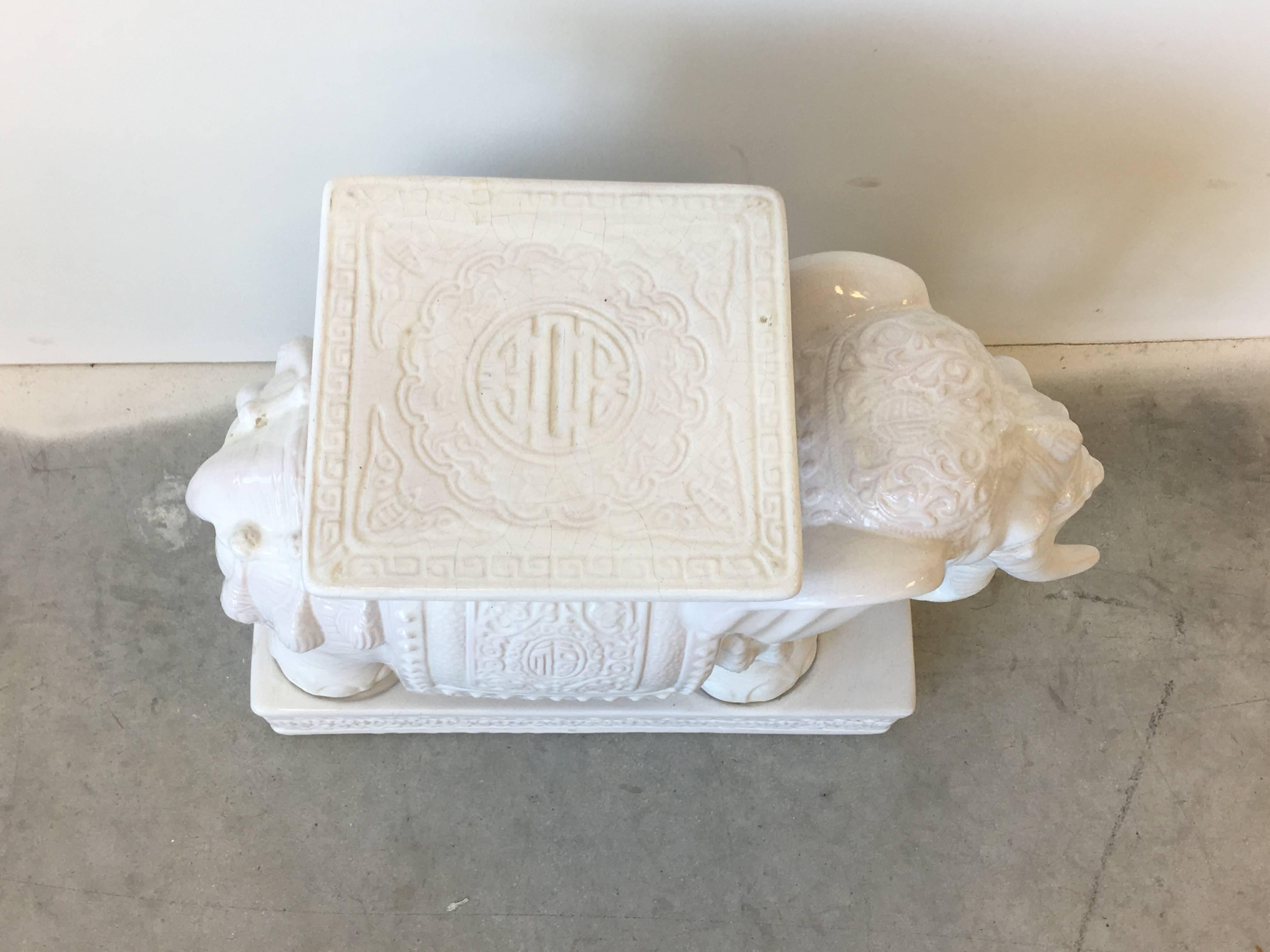 Offered is a gorgeous, Palm Beach style, white ceramic elephant garden stool or side table.