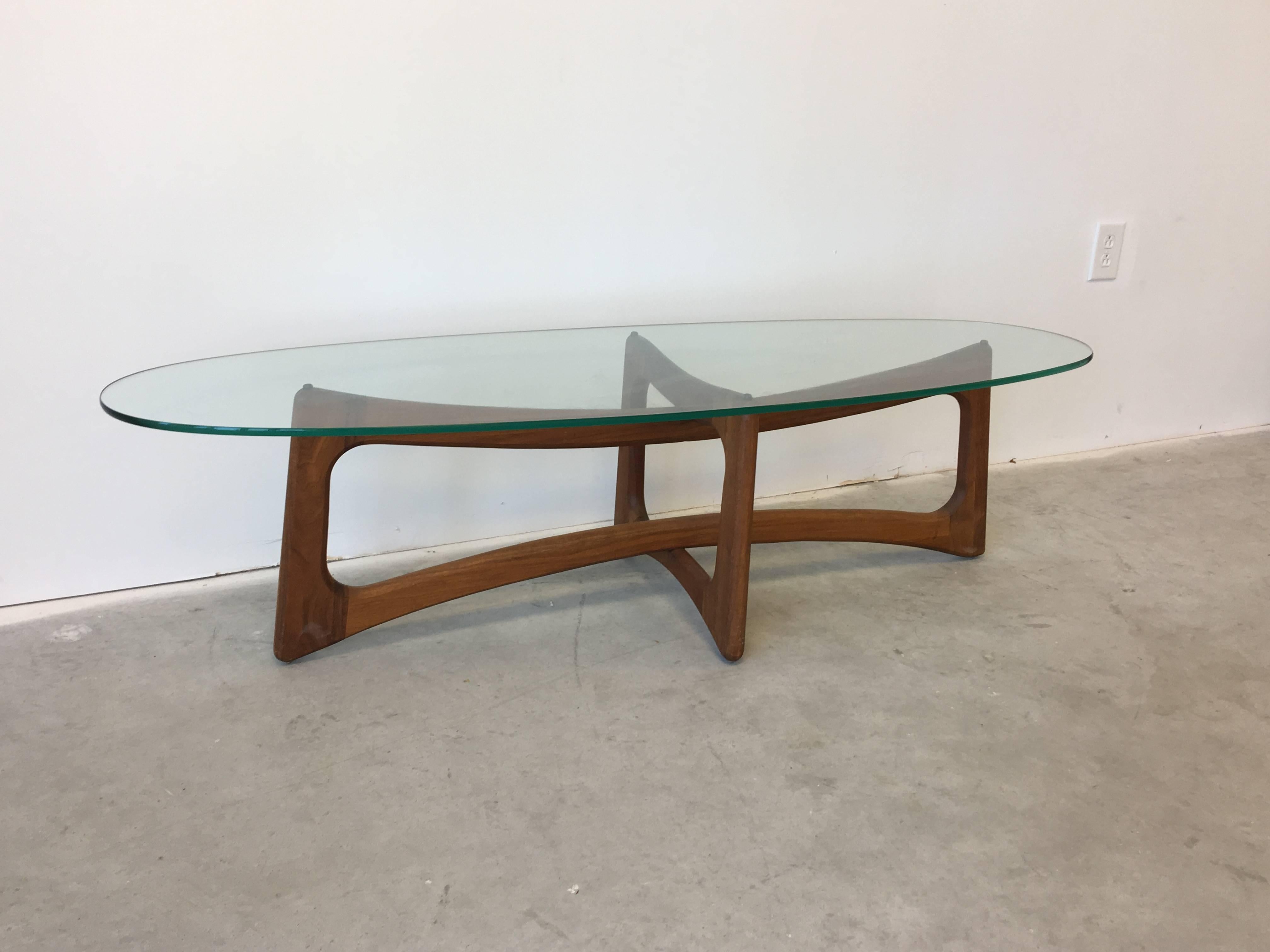 Offered is a truly immaculate, Mid-Century Adrian Pearsall, teak ribbon coffee table with a glass top.