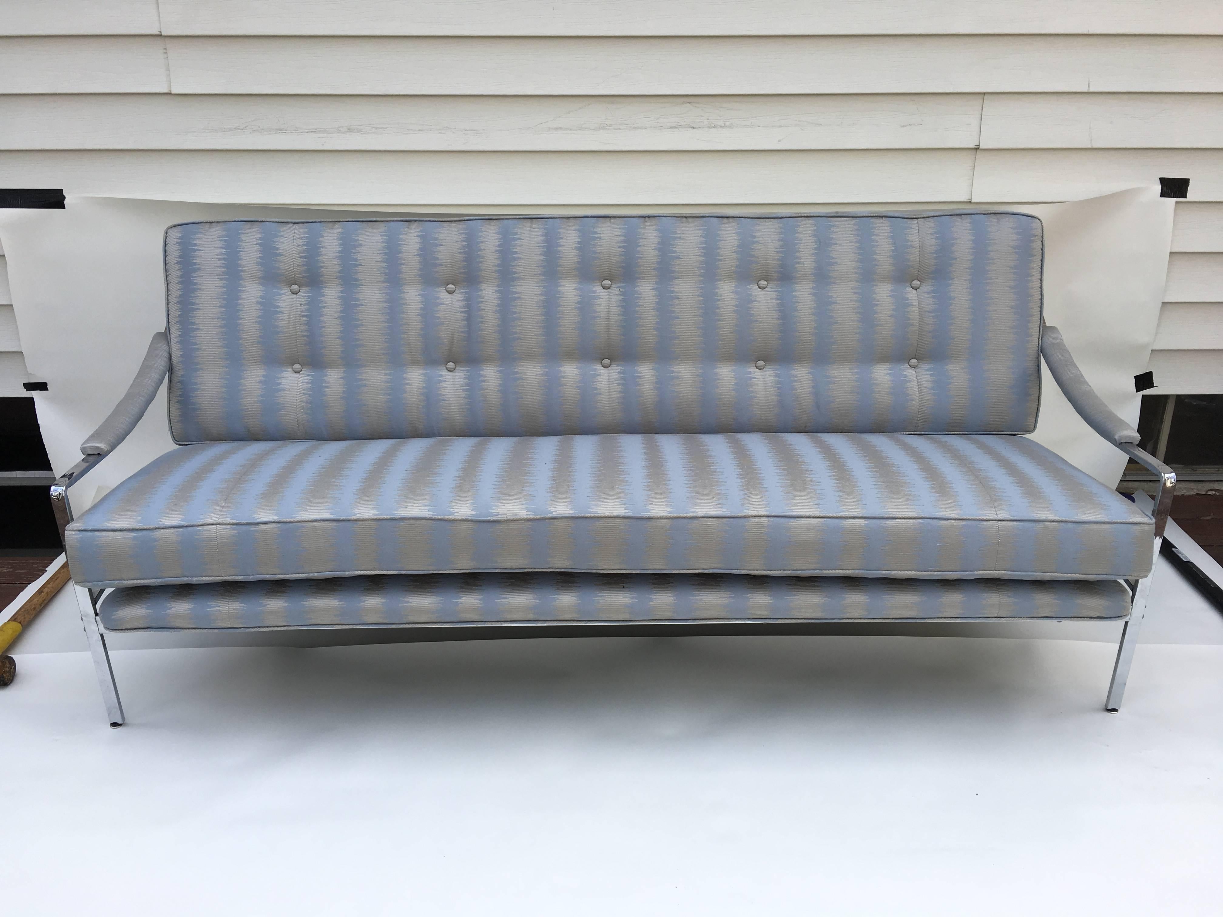 Offered is a stunning 1970s floating chrome sofa, attributed to Milo Baughman. Recently upholstered in a high-end designer ice blue and silver Ikat stripe fabric.