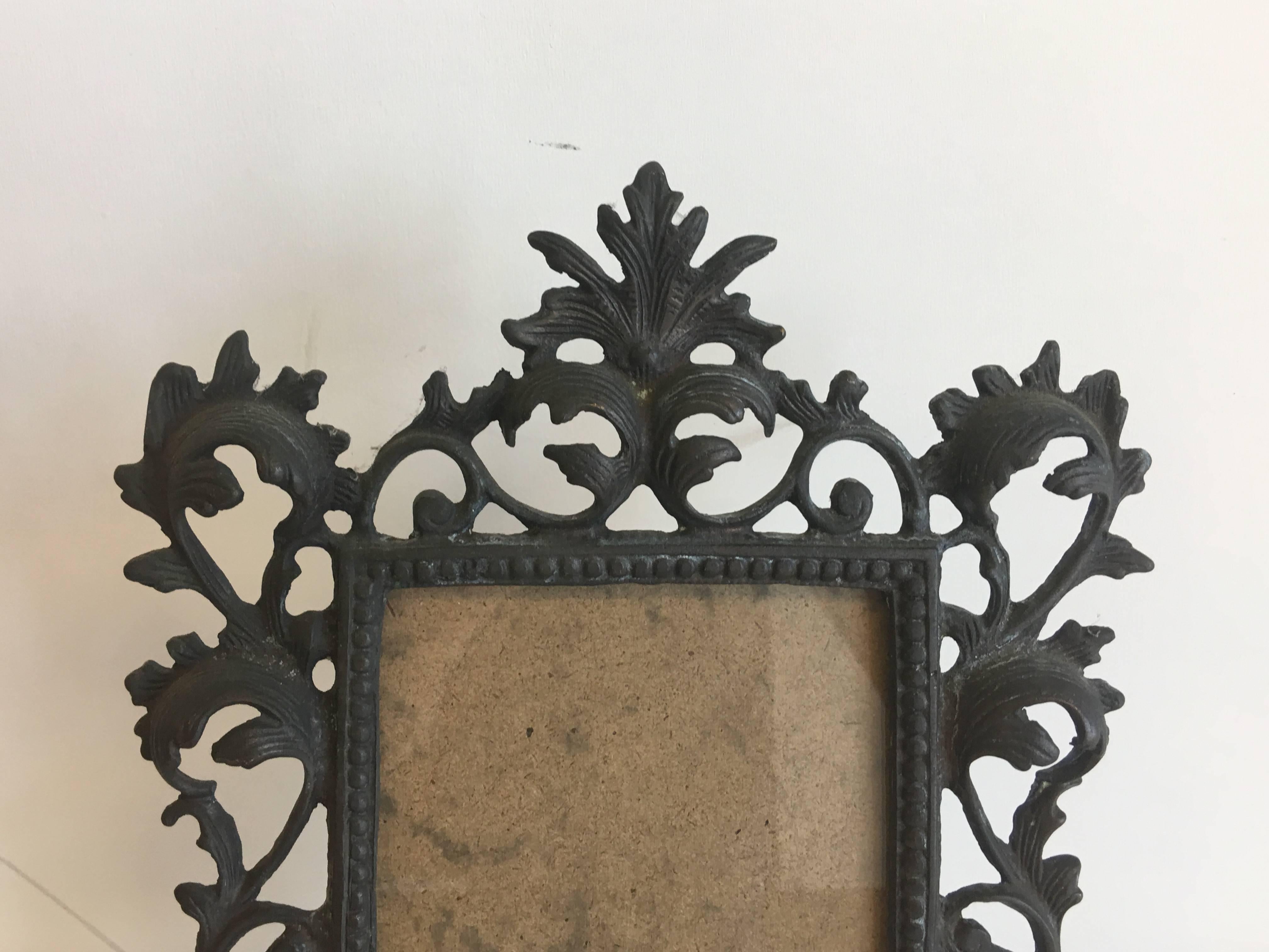 Offered is a fabulous, 19th century Art Nouveau, Louis XV style bronze standing picture frame with heavy detailing. Fits a 5