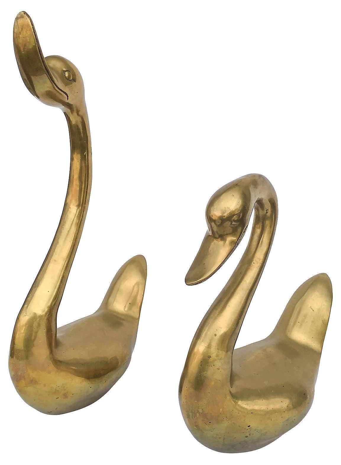 large brass swans
