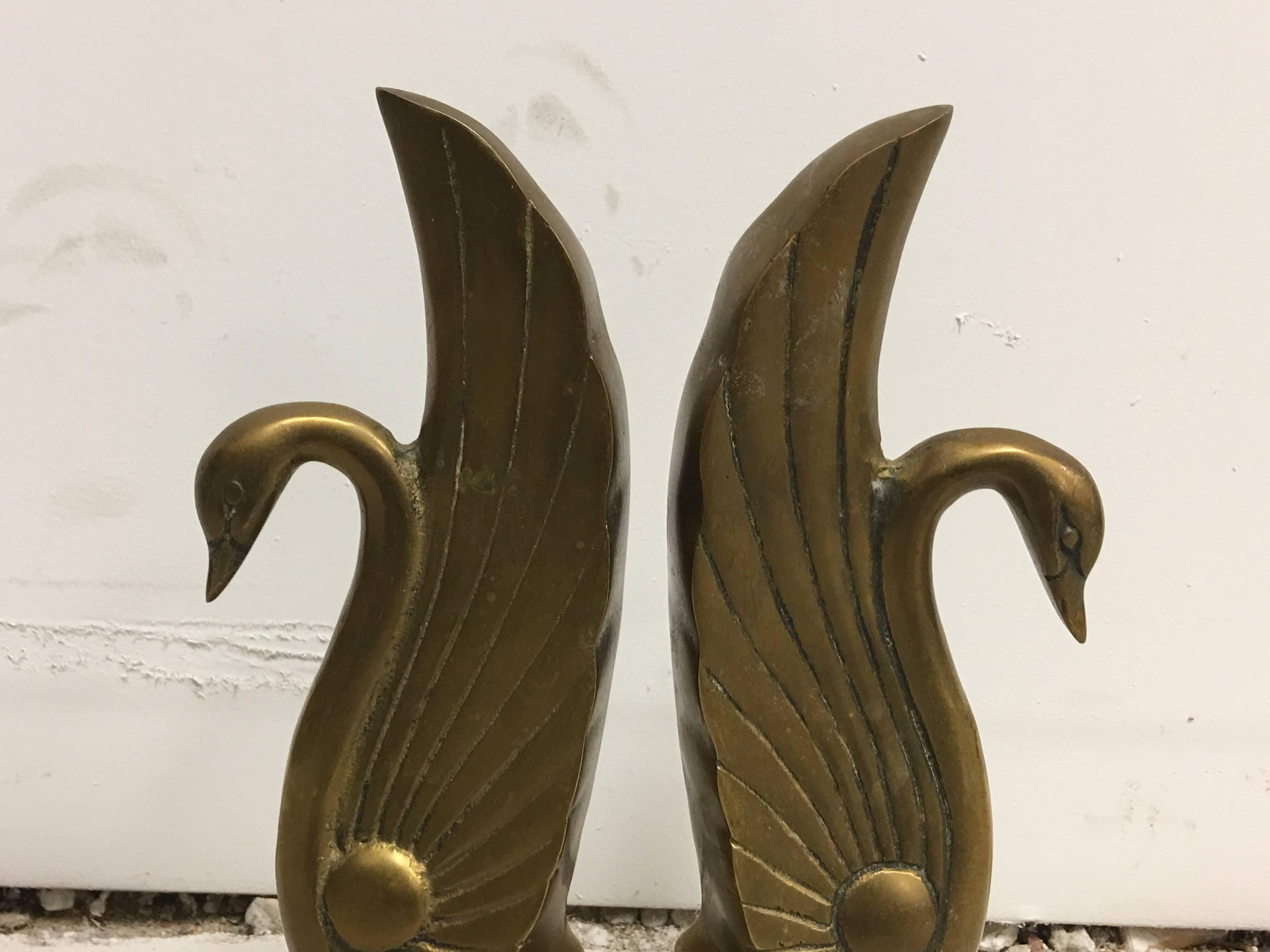 Offered is a gorgeous, pair of 1920s Art Deco solid-brass swan bookends.