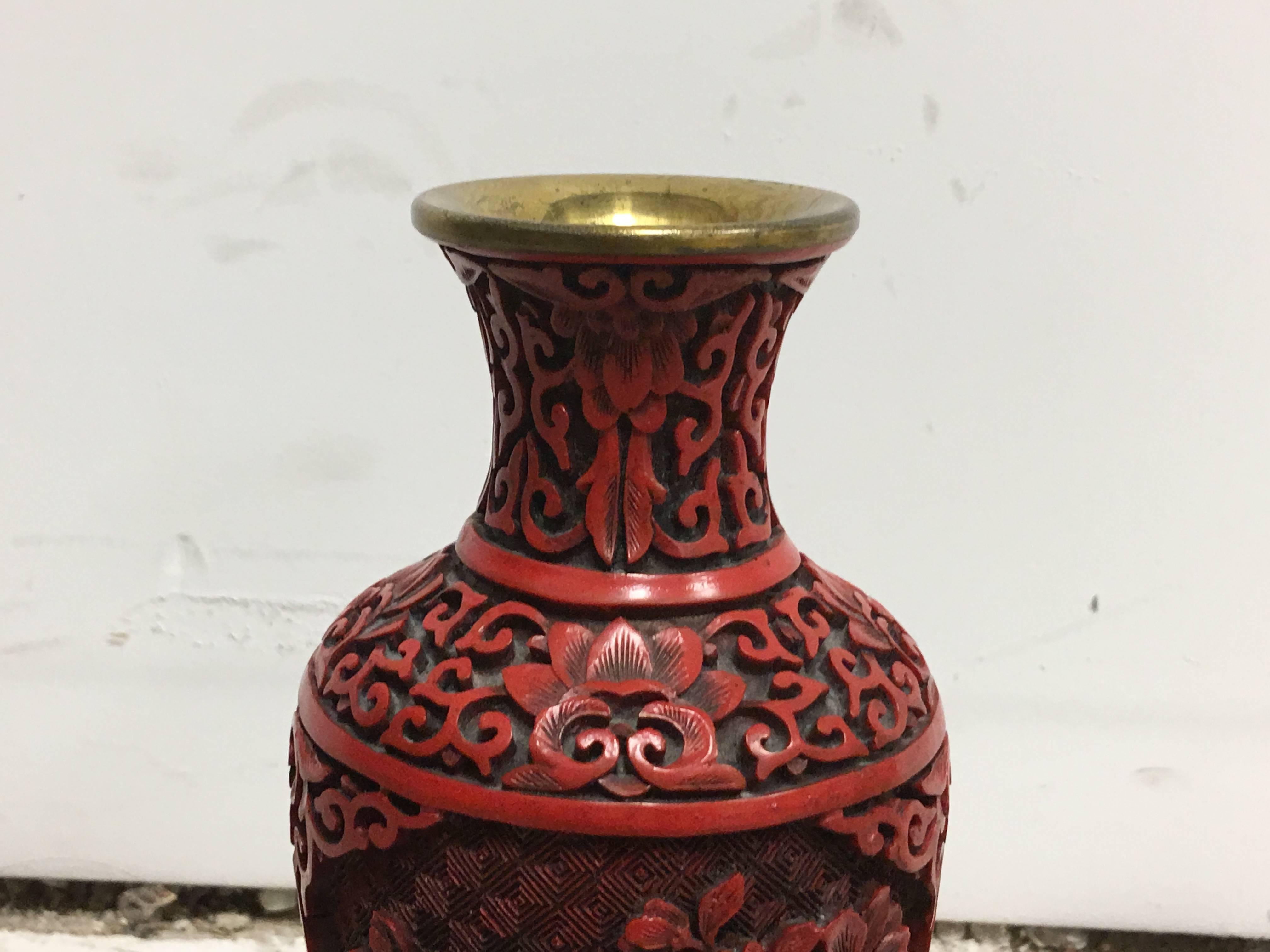 Offered is an elegant, 19th century red Chinese cinnabar cloisonné vase on ornate wood stand.
