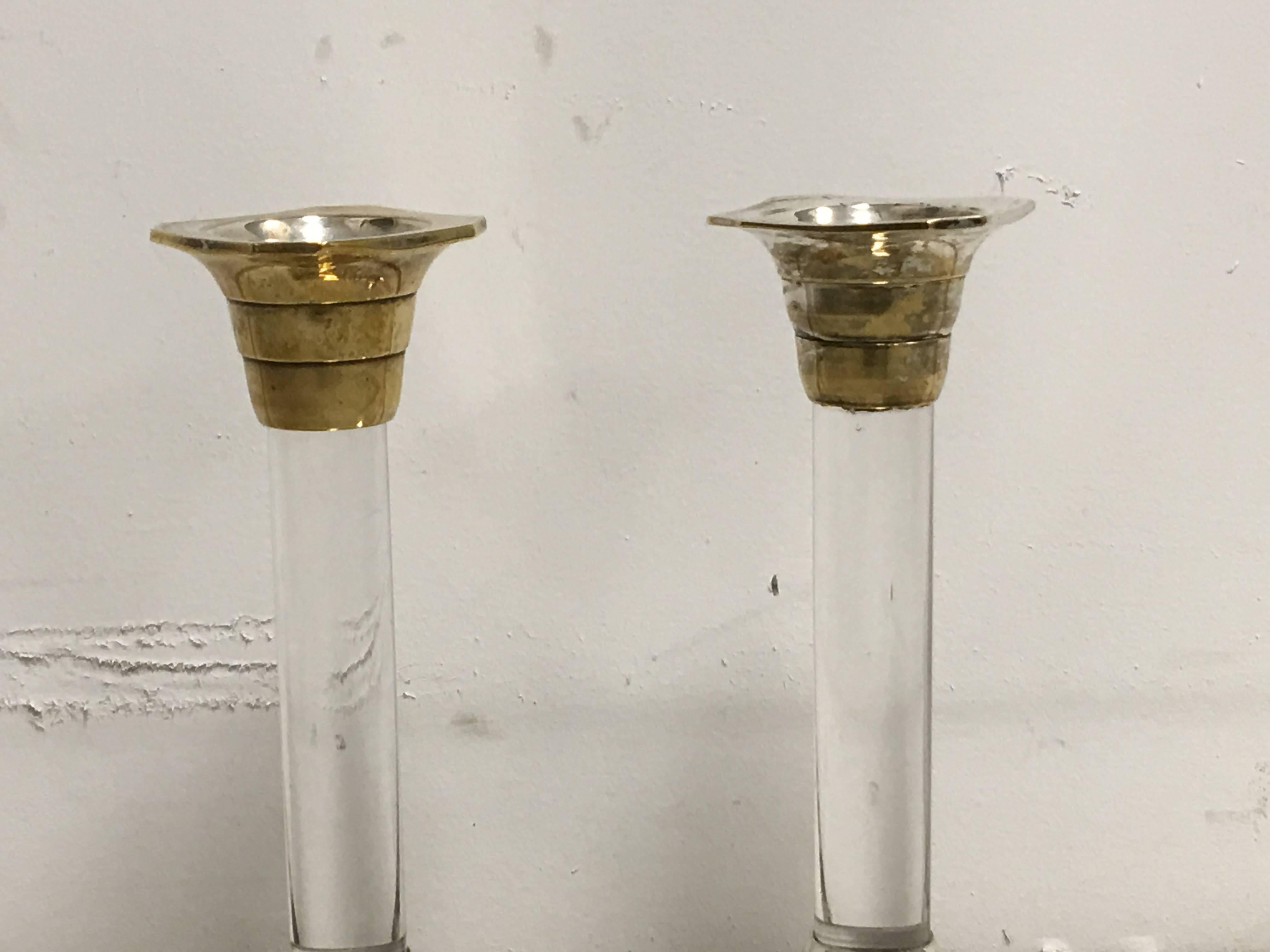 Offered is a beautiful pair of 1960s silver plated and Lucite candlestick holders.