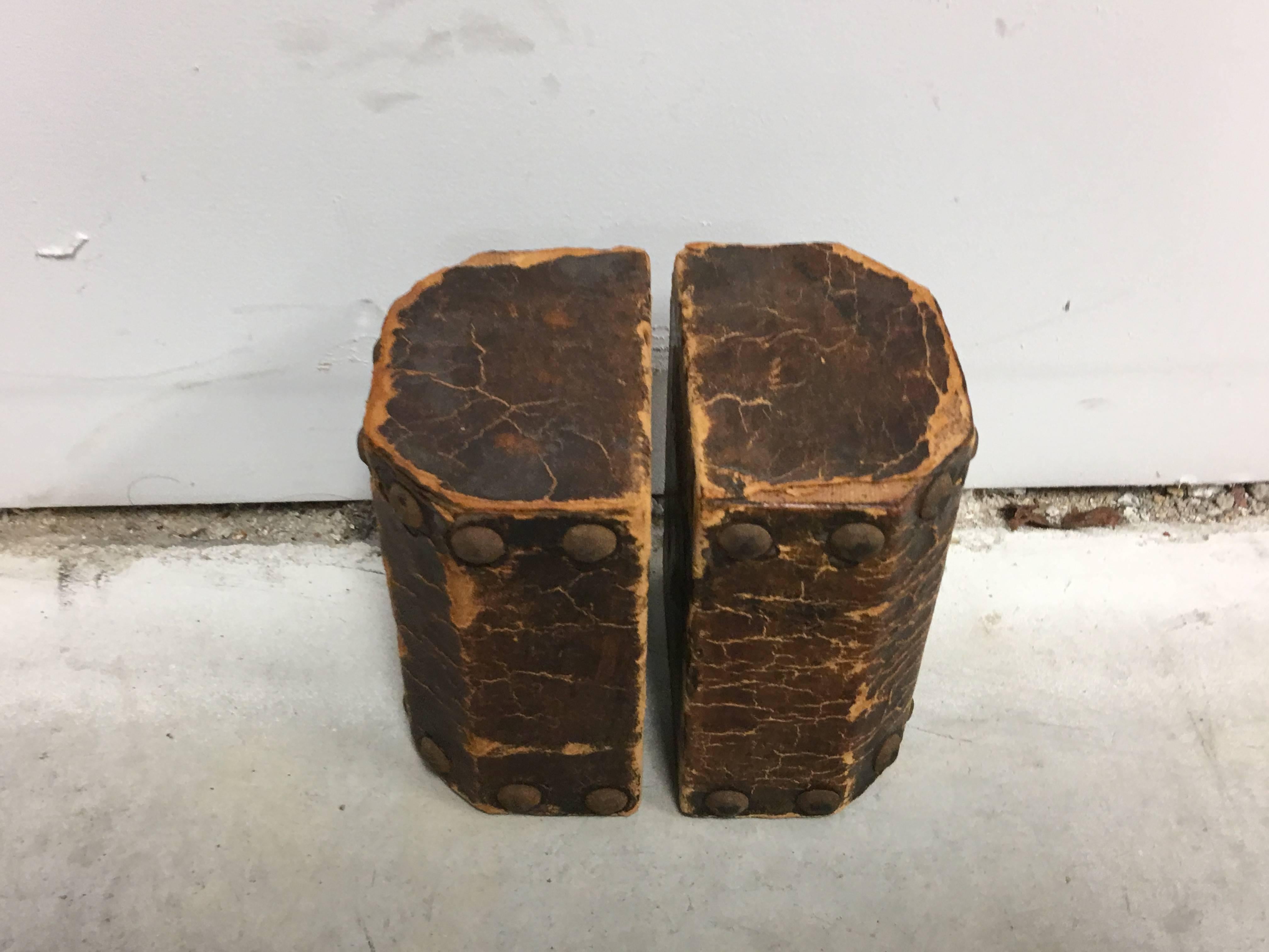 Offered is a handsome, pair of 19th century leather with nailhead trim bookends. Lovely age wear and character, excellent condition for their age.