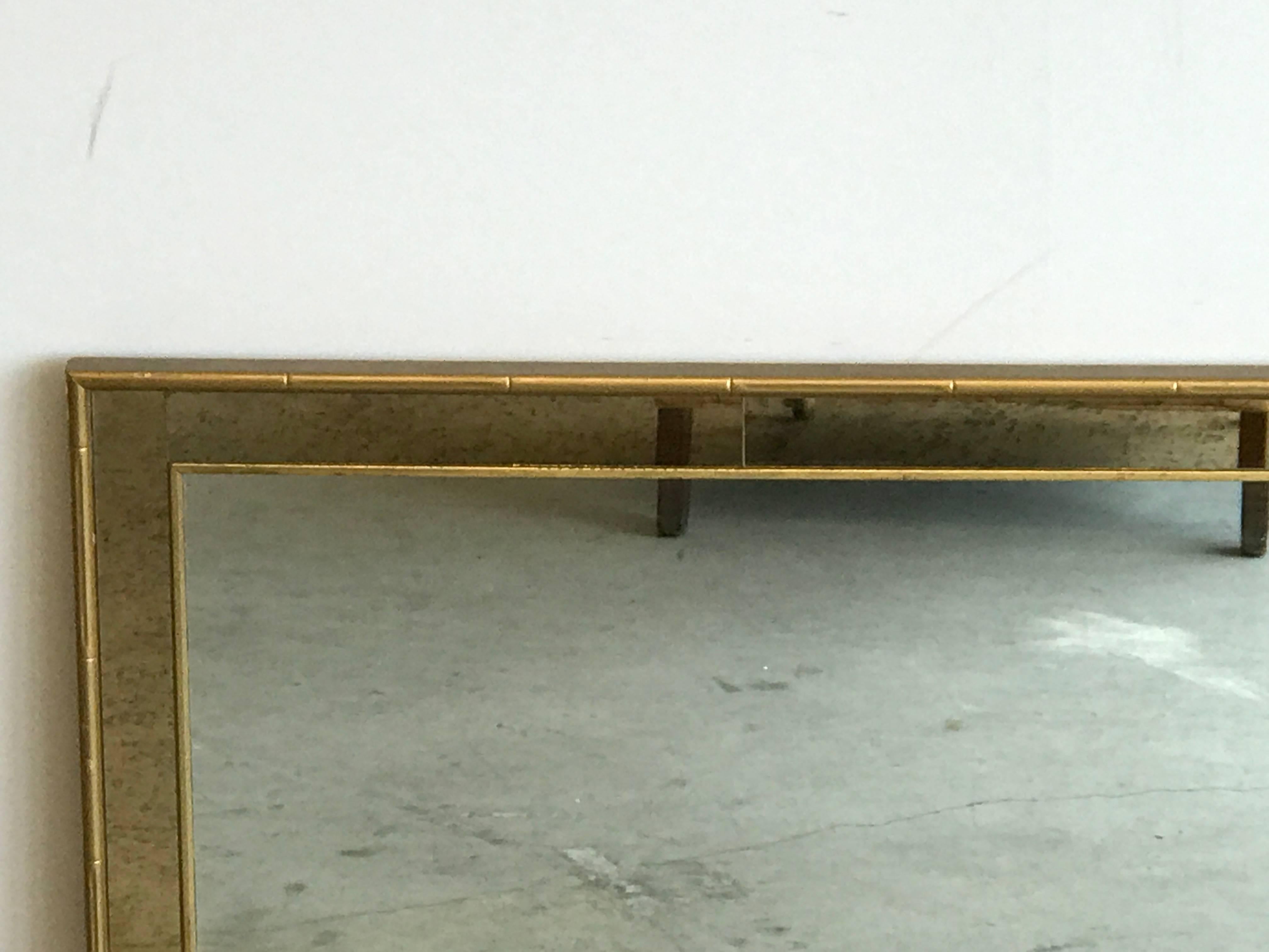 Offered is a stunning, 1960s Labarge faux bamboo gilt mirror with mercury glass styled border.