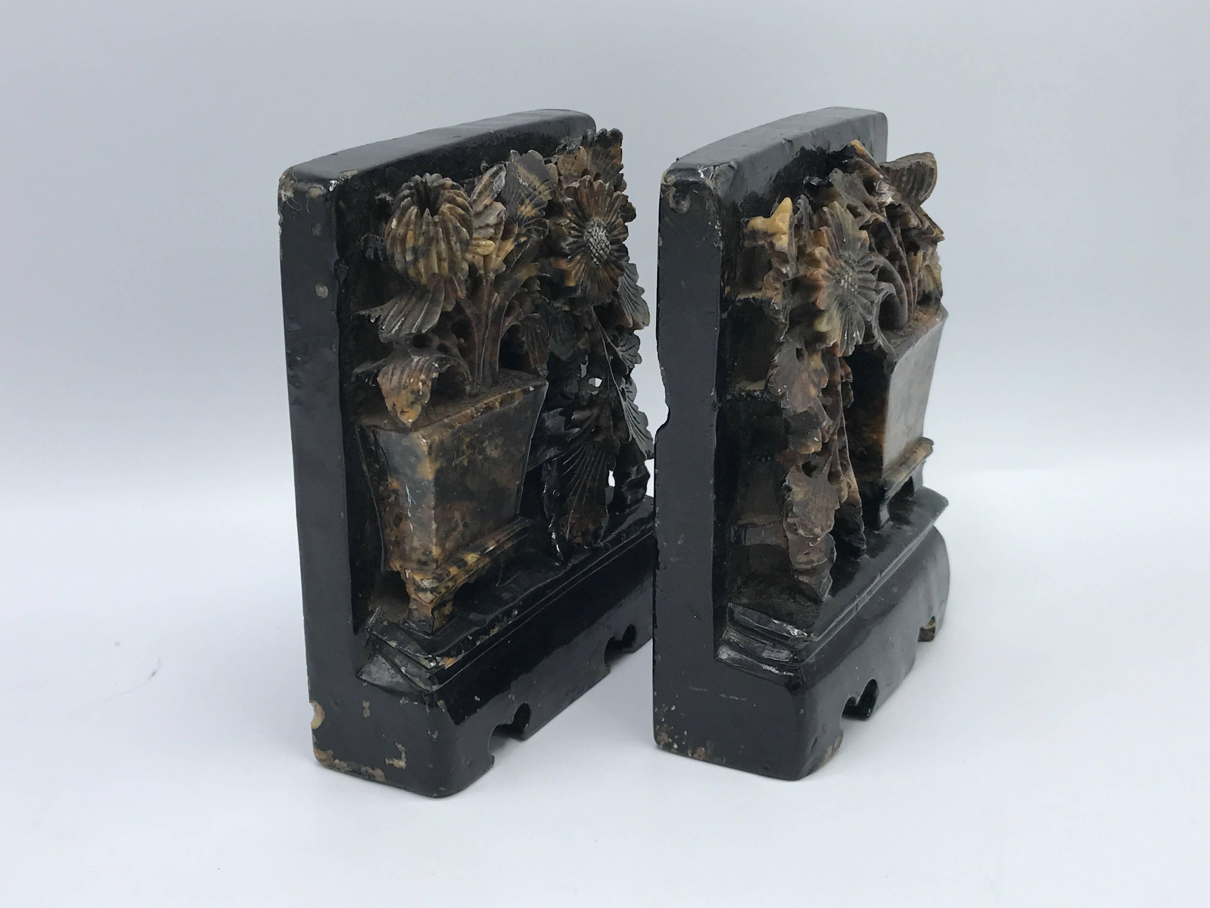 Offered is an absolutely stunning pair of 1920s, carved solid soapstone bookends with carved floral motif.