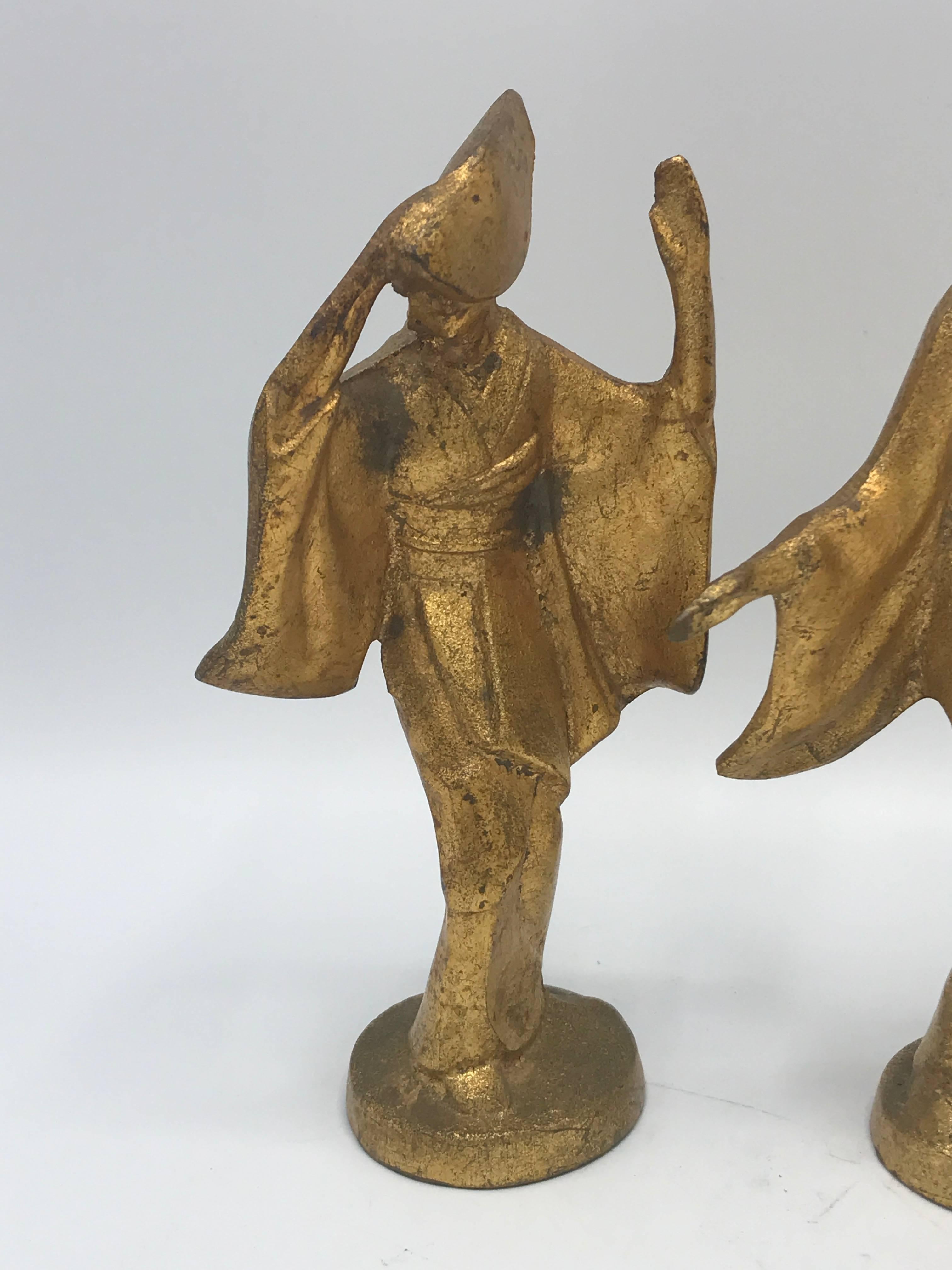 Offered is a gorgeous, set of three, 1950s Jame Mont style, gilded cast iron dancing geishas.