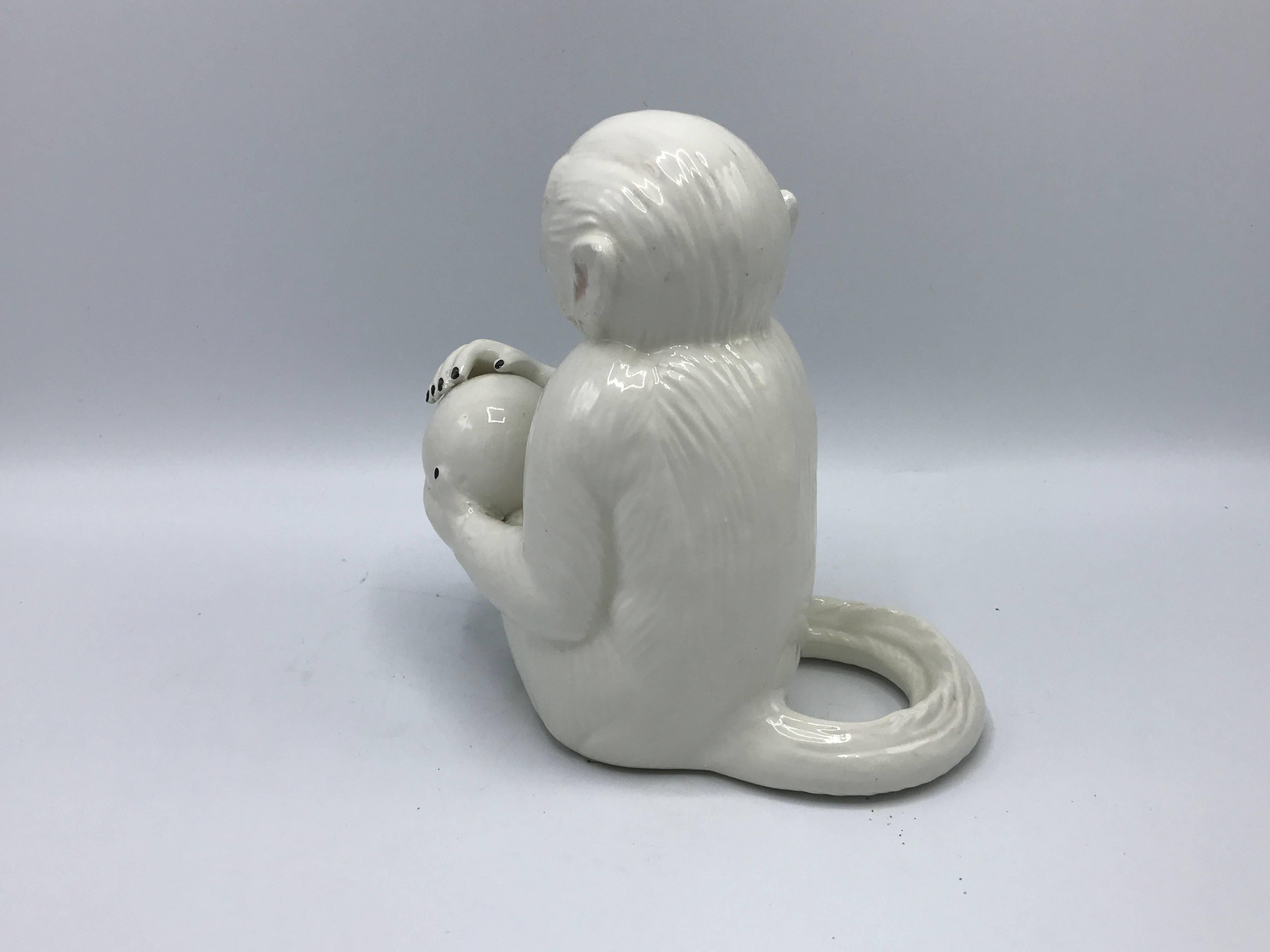 white ceramic monkey
