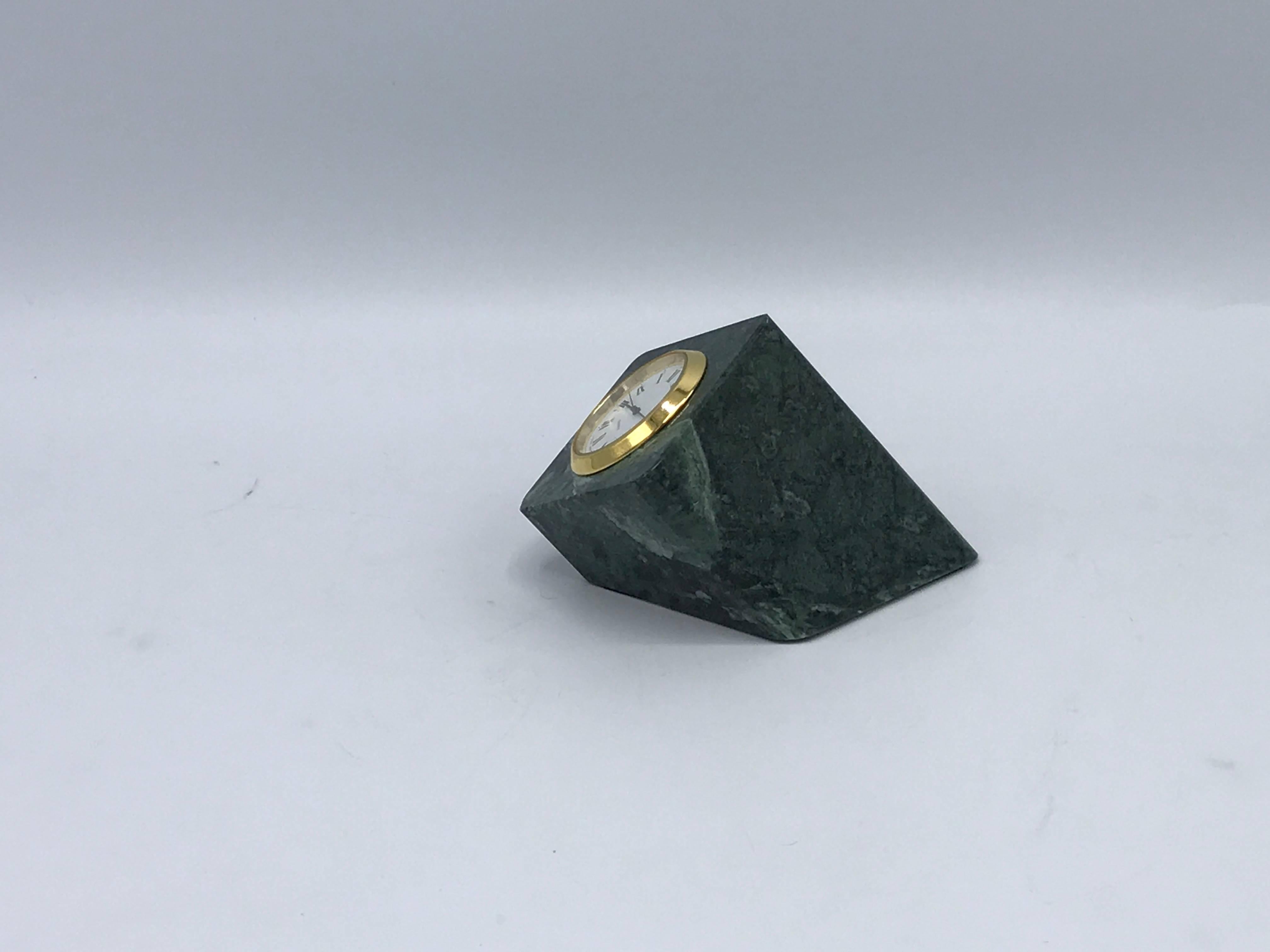Offered is a beautiful, 1960s geometric green marble and brass desk clock.