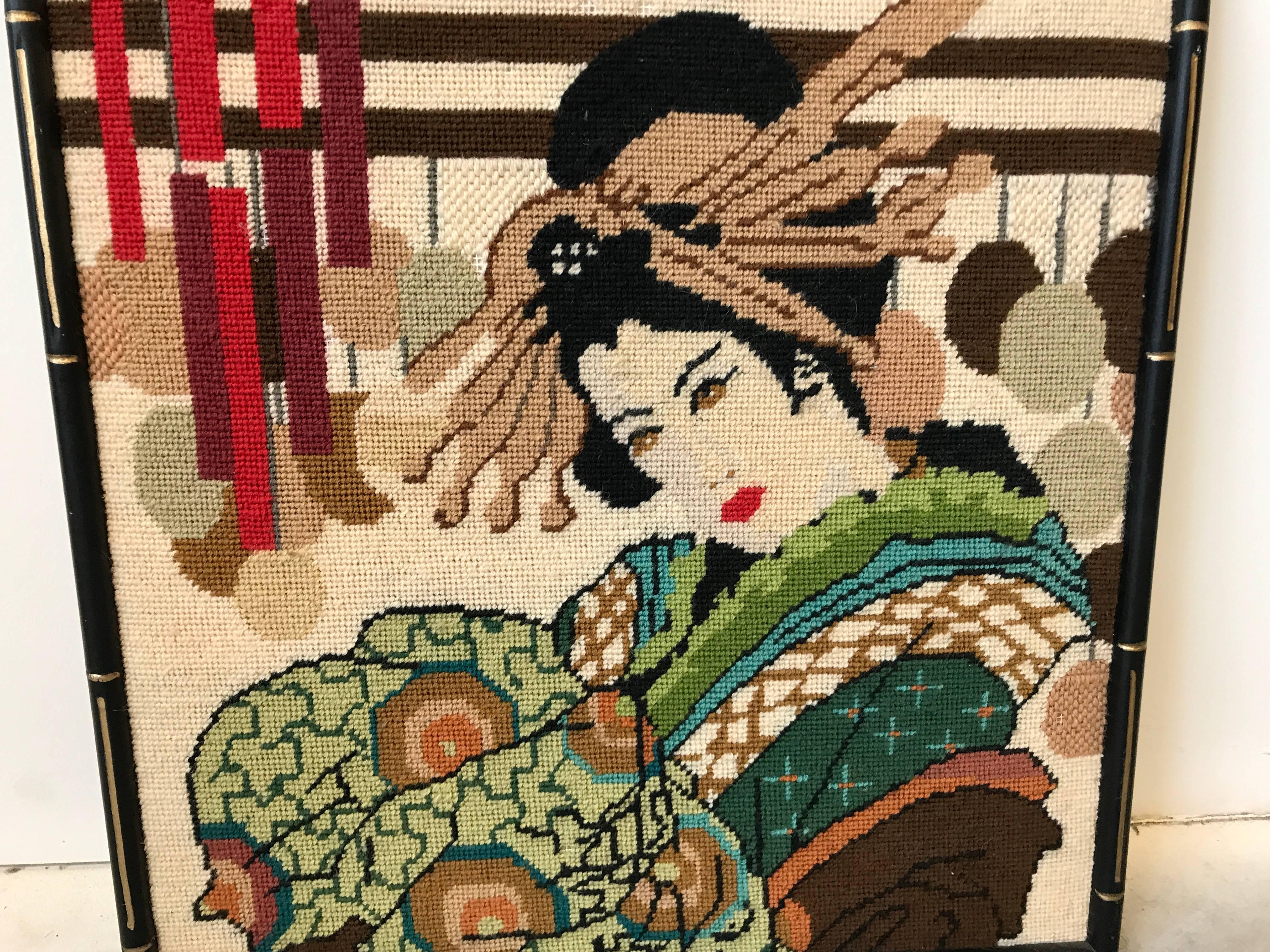 Offered is a fabulous, 1960s needlepoint Geisha in a black faux bamboo frame. Can easily be converted into a needlepoint pillow by removing frame and sewing a backside to it.